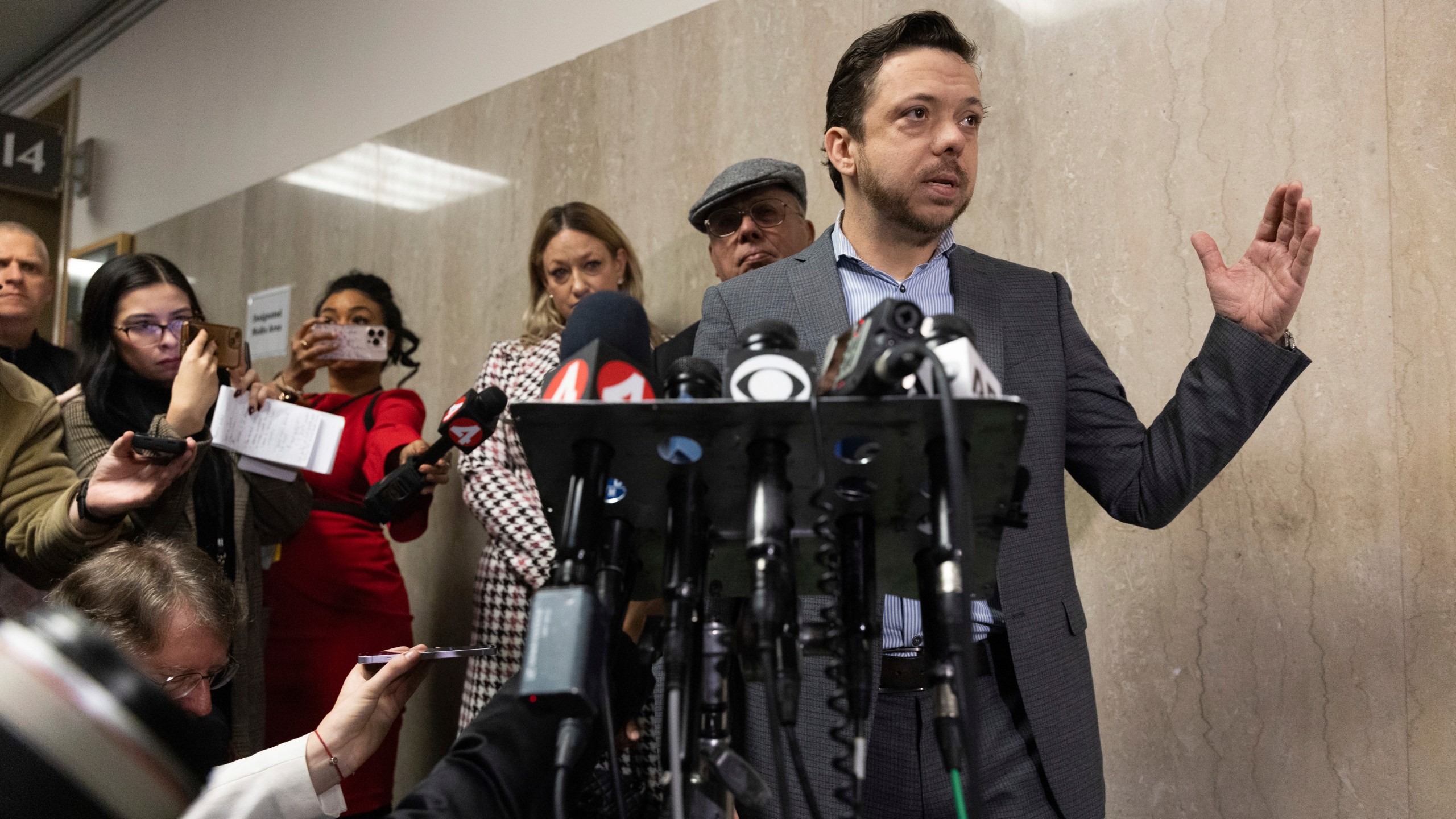 Timothy Oliver Lee, the brother of Bob Lee, makes remarks at the Hall of Justice during the murder trial of Nima Momeni Tuesday, Dec. 17, 2024, in San Francisco. (AP Photo/Benjamin Fanjoy)