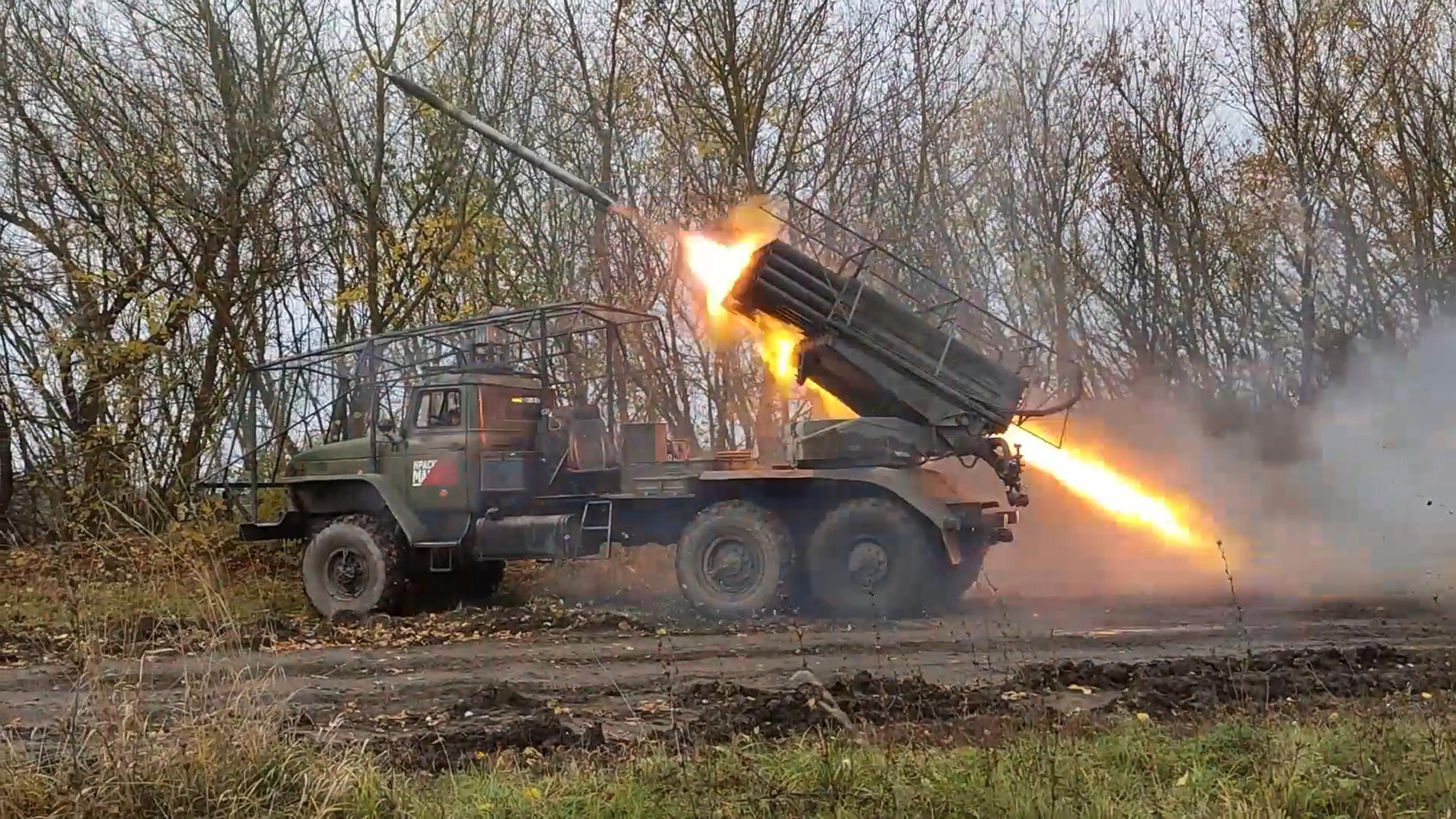 In this photo taken from video released by the Russian Defense Ministry on Tuesday, Dec. 3, 2024, a "Grad" self-propelled 122 mm multiple rocket launcher fires toward Ukrainian position in the Russian - Ukrainian border area in the Kursk region, Russia. (Russian Defense Ministry Press Service photo via AP)