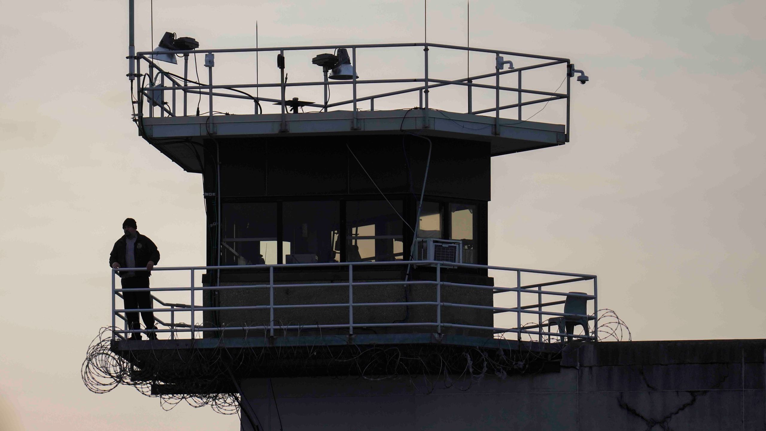 A guard stands in a tower at Indiana State Prison where, barring last-minute court action or intervention by Gov. Eric Holcomb, Joseph Corcoran, 49, convicted in the 1997 killings of his brother and three other people, is scheduled to be put to death by lethal injection before sunrise Tuesday, Dec. 17, 2024, in Michigan City, Ind. (AP Photo/Erin Hooley)