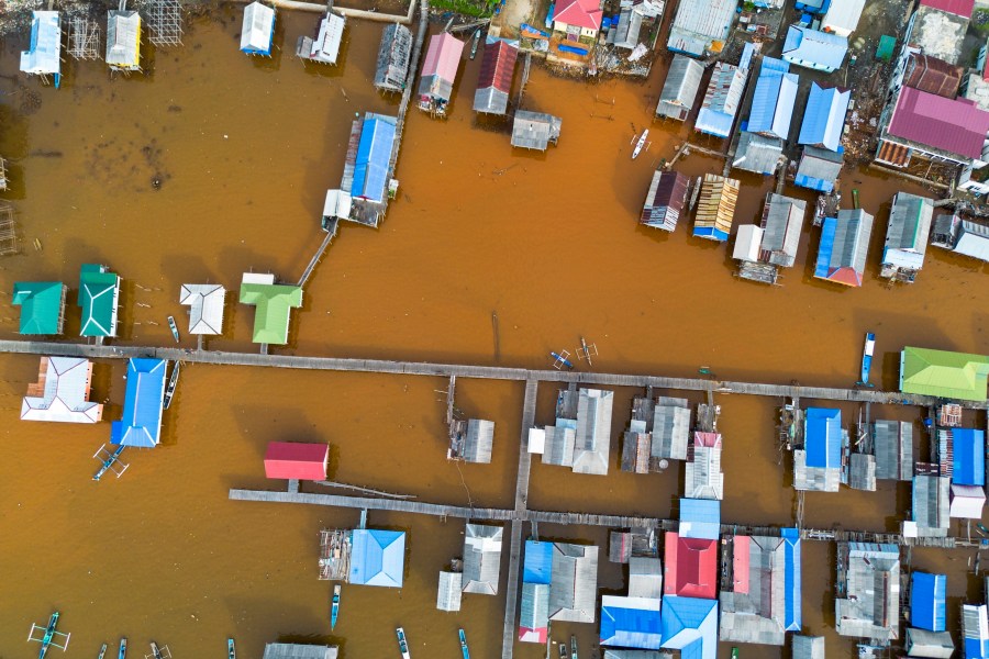 Murky brown water is visible near nickel mining activities that surround Baliara village on Kabaena Island, Southeast Sulawesi, Friday, Nov. 15, 2024. (AP Photo/Yusuf Wahid)