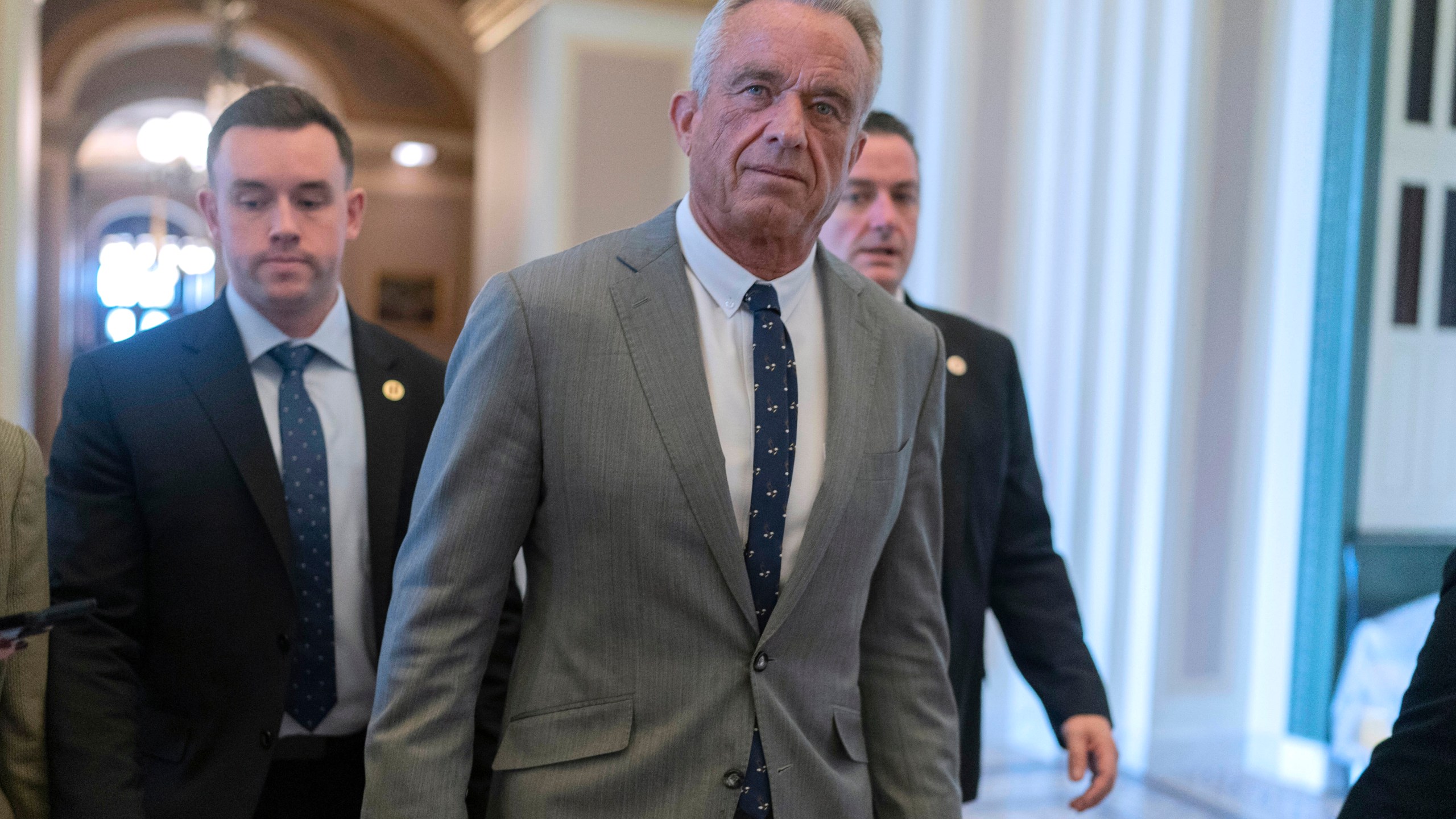 Robert F. Kennedy Jr., President-elect Donald Trump's nominee to be Secretary of Health and Human Services, walks to meet with Sen. John Thune, R-S.D. at the Capitol in Washington, Tuesday, Dec. 17, 2024. (AP Photo/Jose Luis Magana)