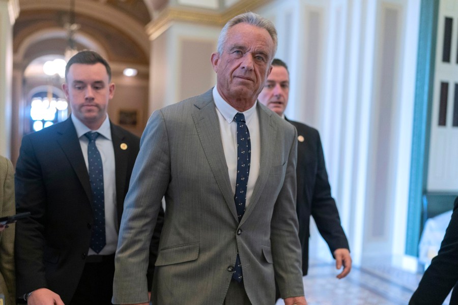 Robert F. Kennedy Jr., President-elect Donald Trump's nominee to be Secretary of Health and Human Services, walks to meet with Sen. John Thune, R-S.D. at the Capitol in Washington, Tuesday, Dec. 17, 2024. (AP Photo/Jose Luis Magana)