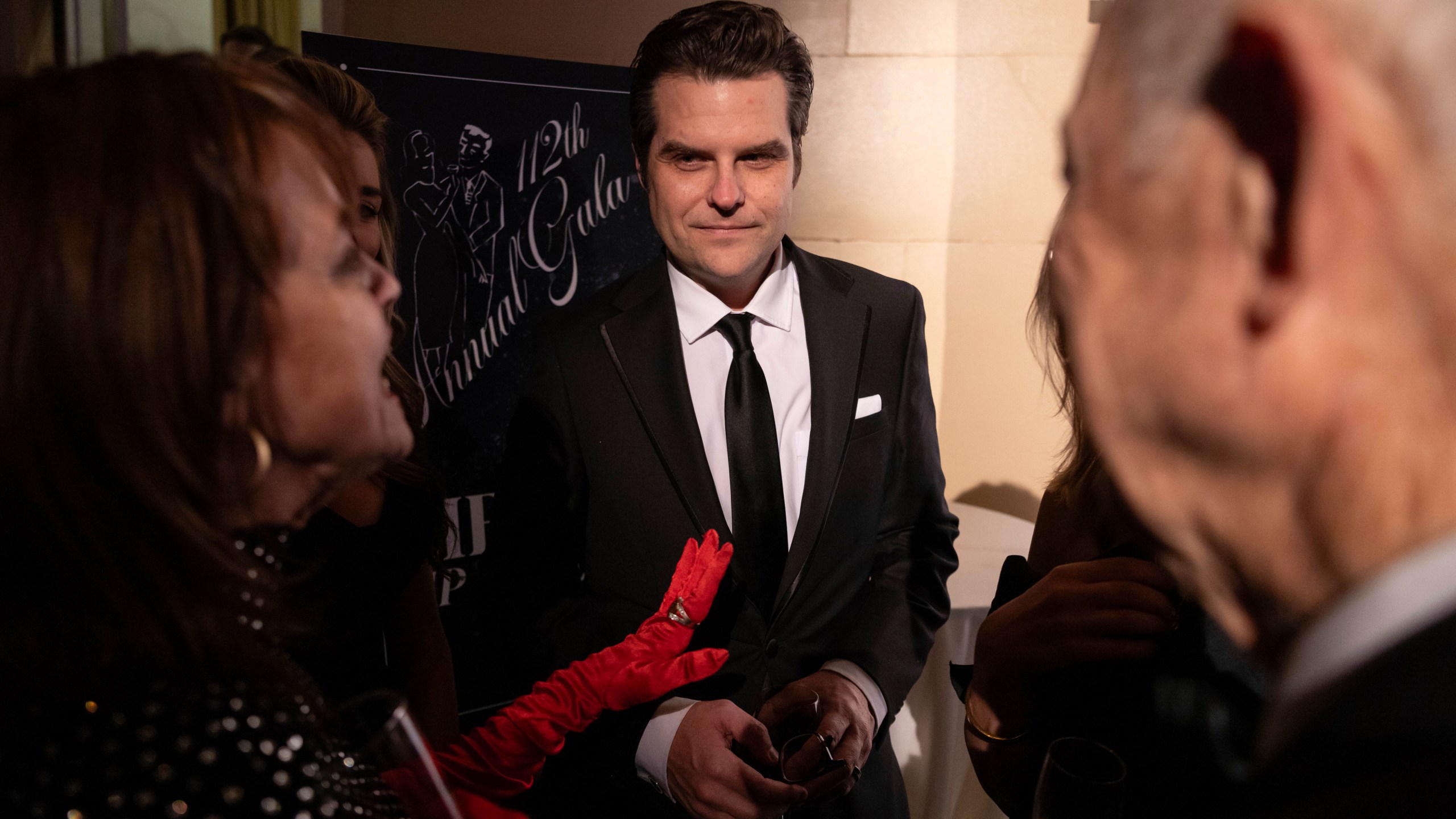 Former Rep. Matt Gaetz, R-Fla., center, attends the cocktail hour of New York Young Republican Club's annual gala at Cipriani Wall Street, Sunday, Dec. 15, 2024, in New York. (AP Photo/Yuki Iwamura)