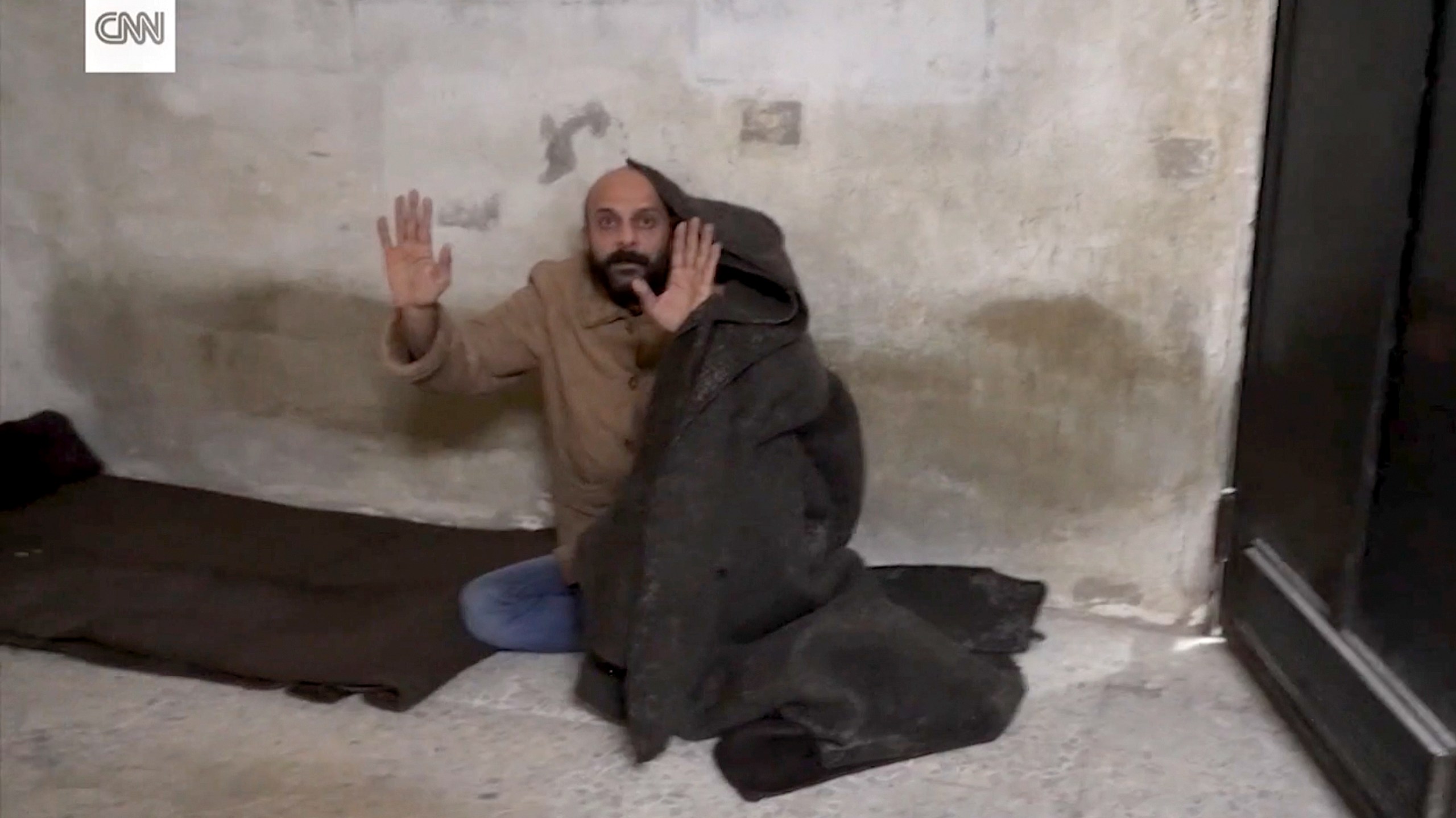 This image taken from vide provided by CNN shows a man who was freed after reporter Clarissa Ward and a Syrian rebel guard discovered him locked in a Damascus prison. It was featured in a story that ran in early December 2024, but CNN has since discovered that the prisoner had lied about his identity. (CNN via AP)