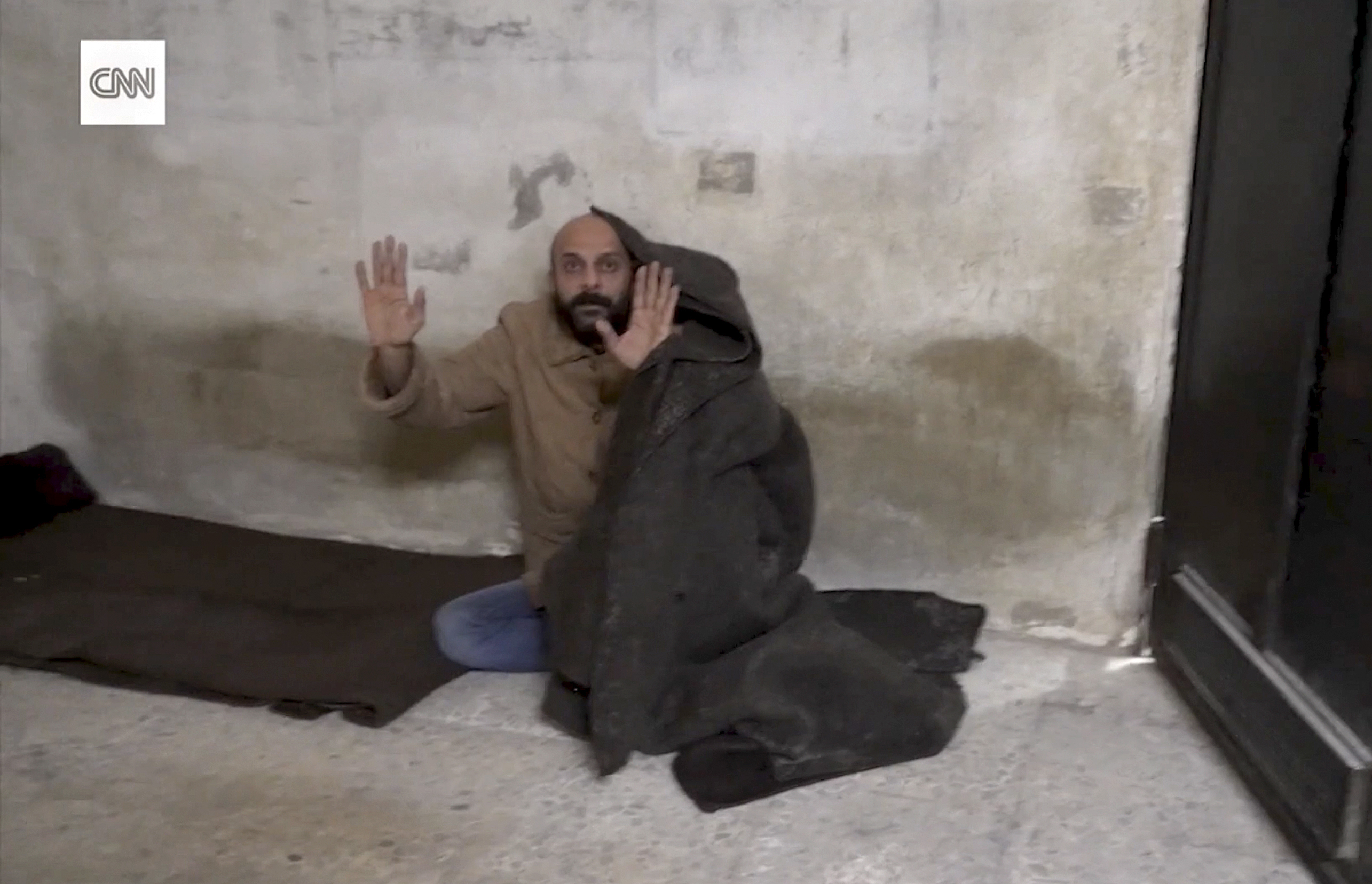 This image taken from vide provided by CNN shows a man who was freed after reporter Clarissa Ward and a Syrian rebel guard discovered him locked in a Damascus prison. It was featured in a story that ran in early December 2024, but CNN has since discovered that the prisoner had lied about his identity. (CNN via AP)