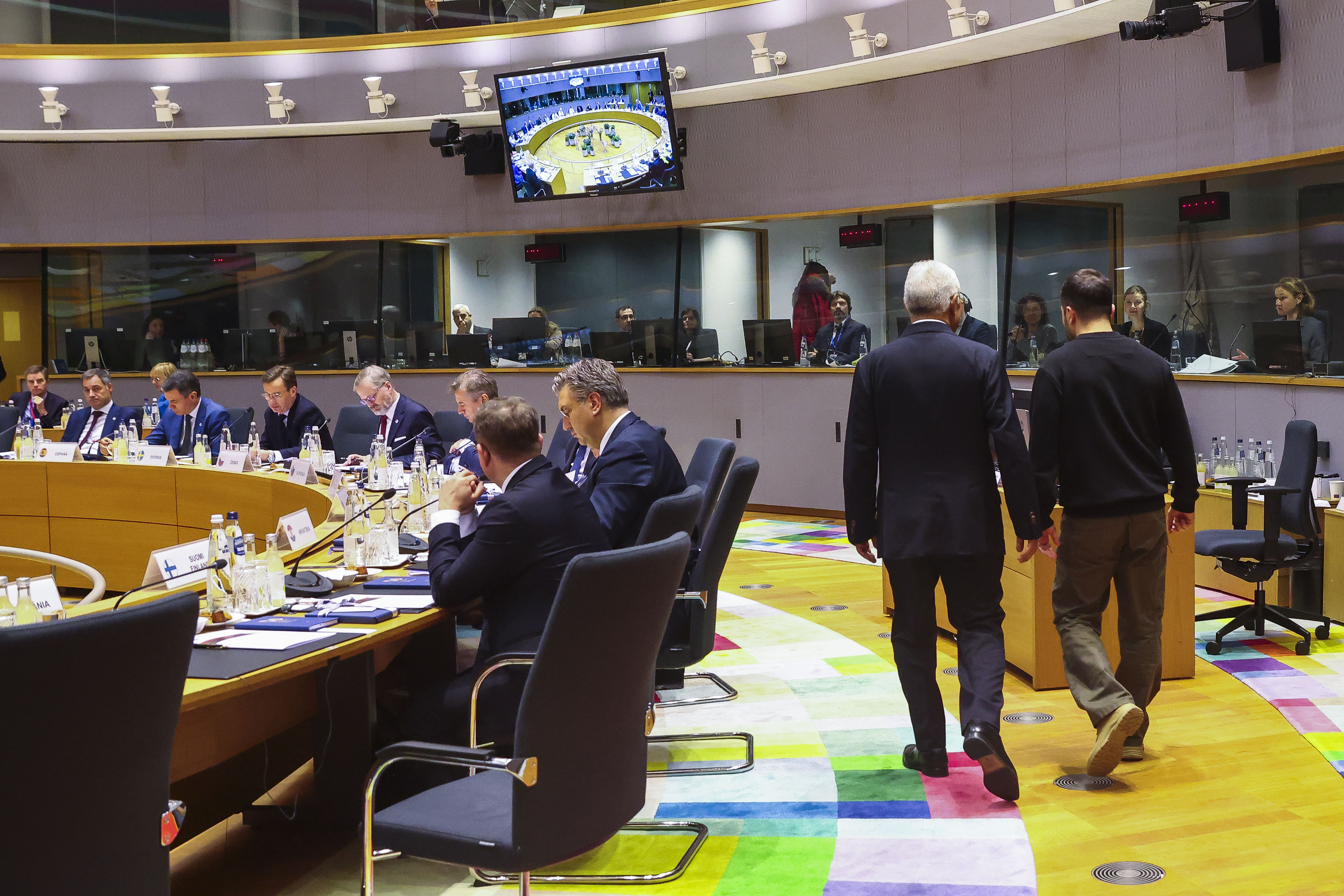 Ukraine's President Volodymyr Zelenskyy, right, and European Council President Antonio Costa arrives for a round table meeting during an EU summit in Brussels on Thursday, Dec. 19, 2024. (Johanna Geron, Pool Photo via AP)