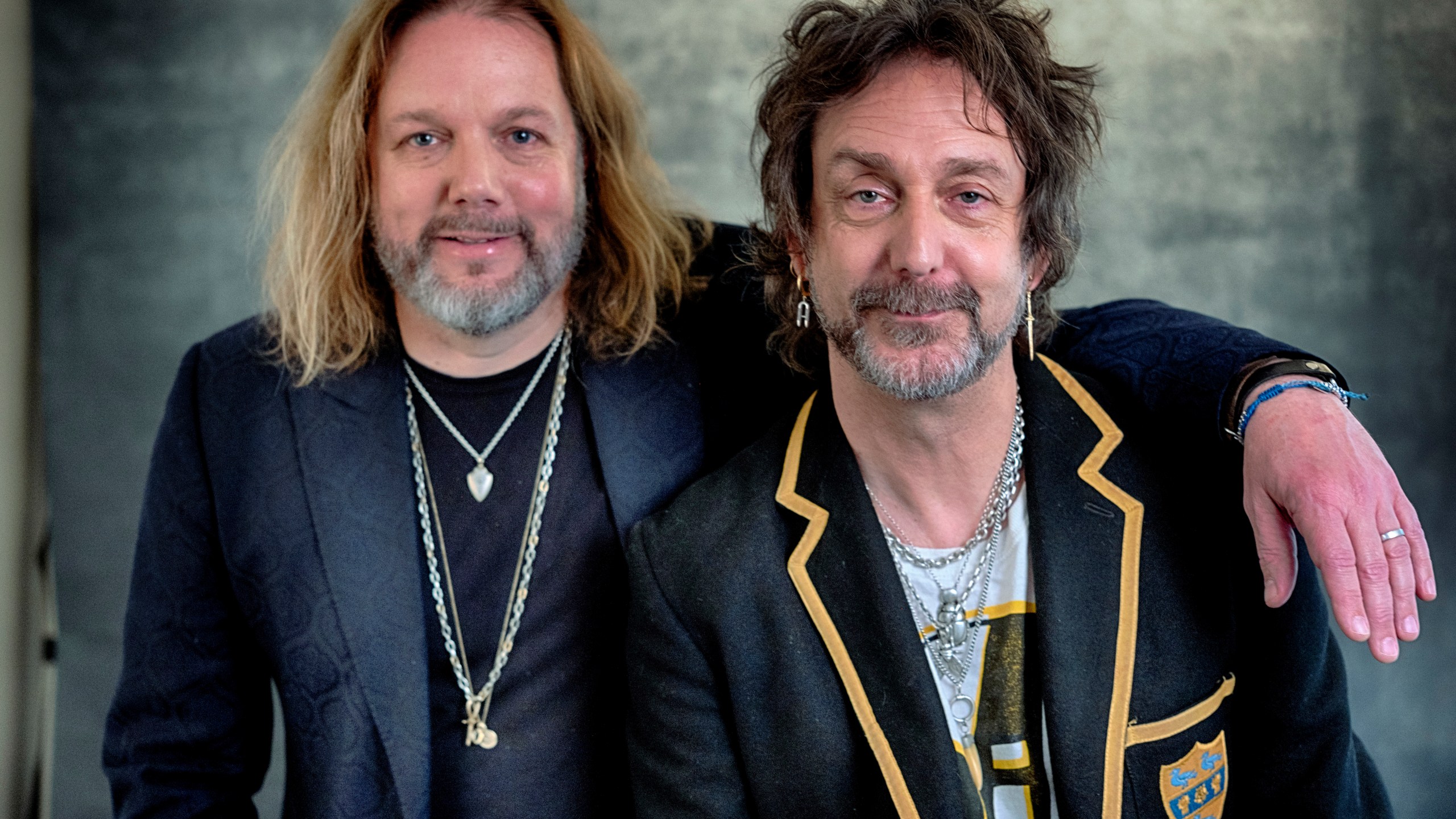 Rich Robinson, left, and his brother Chris Robinson of The Black Crowes pose for a portrait in Los Angeles on Monday, Dec. 9, 2024. (AP Photo/Richard Vogel)