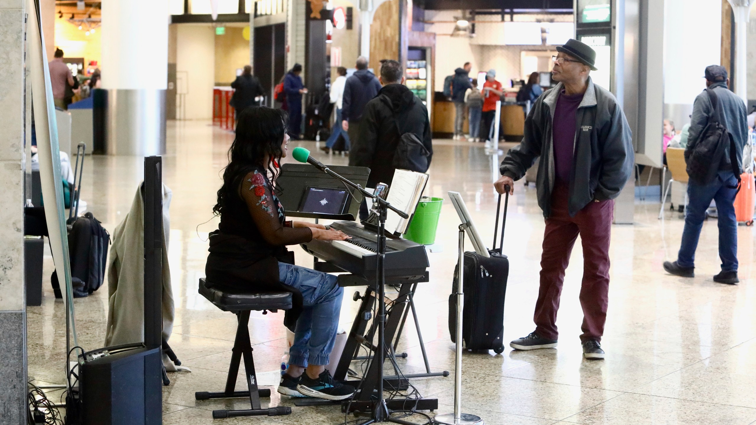 Roz McCommon performs at Seattle-Tacoma International Airport on November 26, 2024, in SeaTac, Wash. (AP Photo/Manuel Valdes)