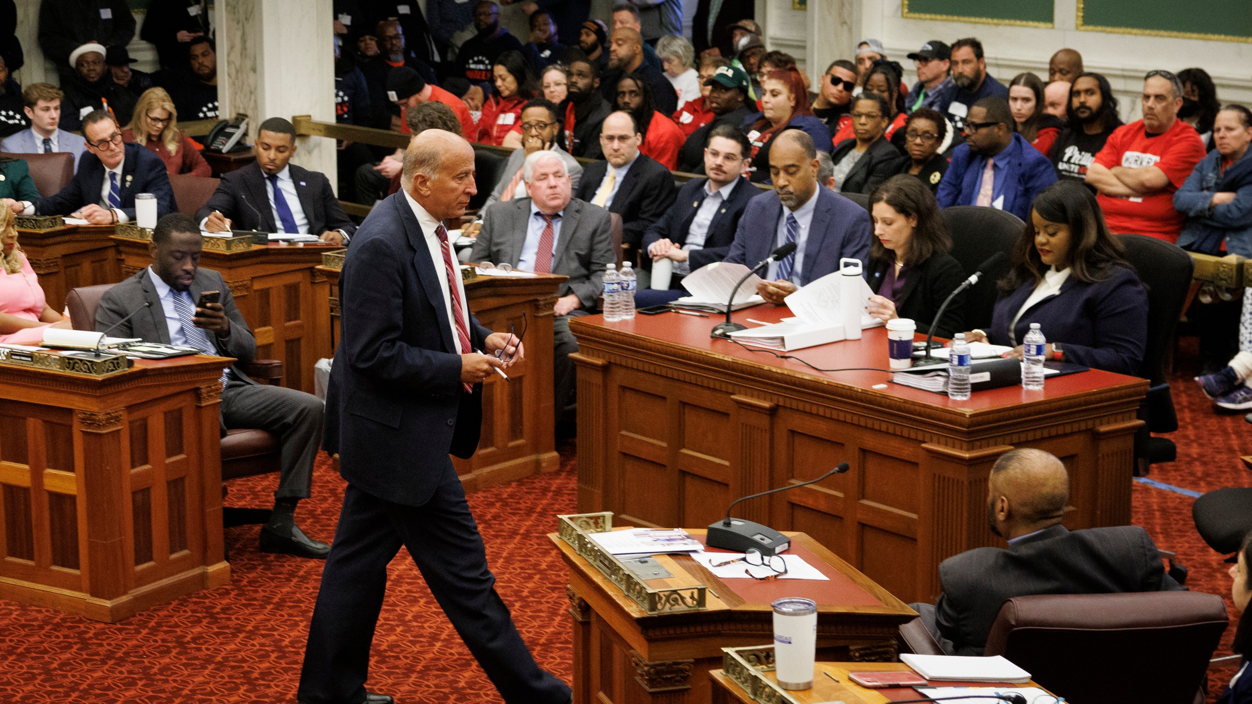 FILE - City Councilman Mark Squilla walks across the chambers at the start of a public hearing on the construction of a new arena for the NBA basketball team Philadelphia 76ers, Nov. 12, 2024, in Philadelphia. (Alejandro A. Alvarez/The Philadelphia Inquirer via AP, File)