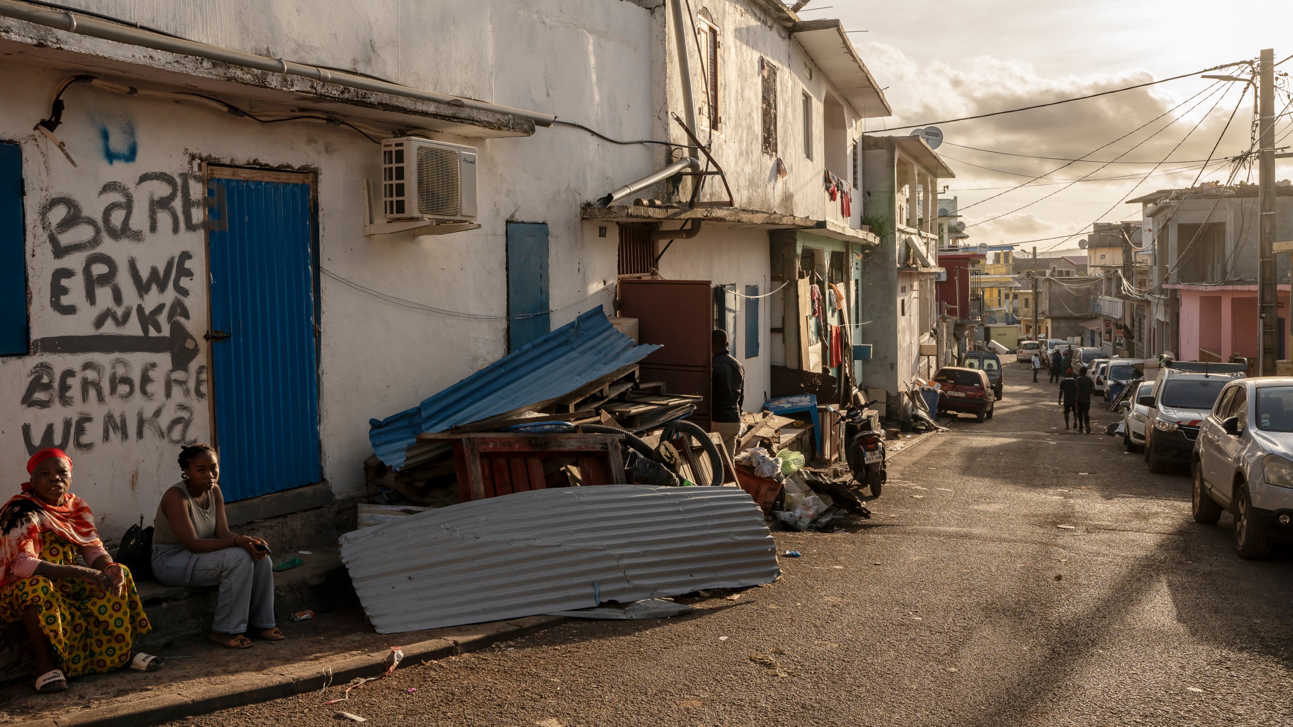 Cleared debris after Cyclone Chido are seen in the Kaweni slum on the outskirts of Mamoudzou, in the French Indian Ocean island of Mayotte, Thursday, Dec. 19, 2024. (AP Photo/Adrienne Surprenant)