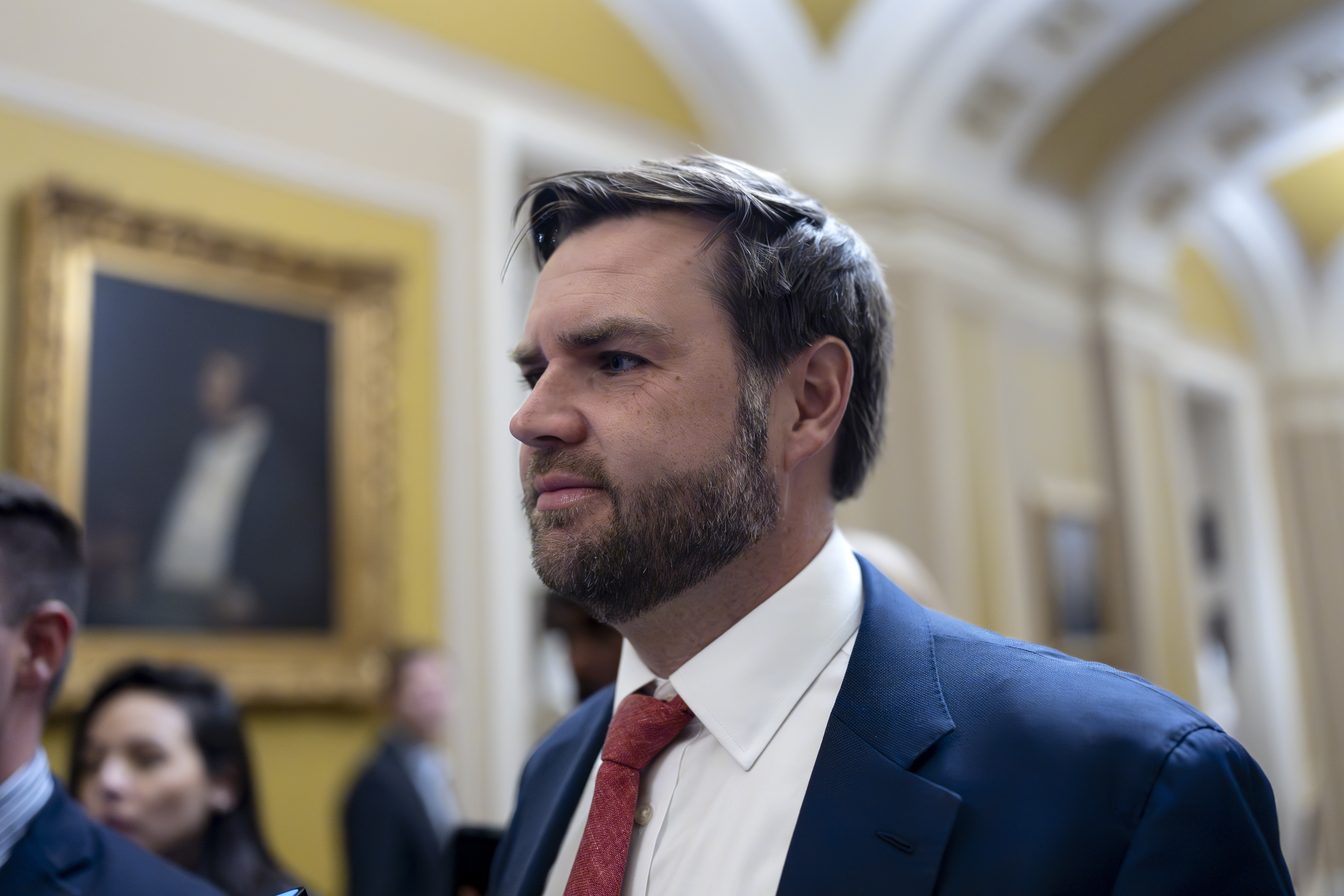 Sen. JD Vance, R-Ohio, the vice president-elect, leaves the Senate chamber as lawmakers work on an interim spending bill to avoid a shutdown of federal agencies, at the Capitol in Washington, Wednesday, Dec. 18, 2024. (AP Photo/J. Scott Applewhite)