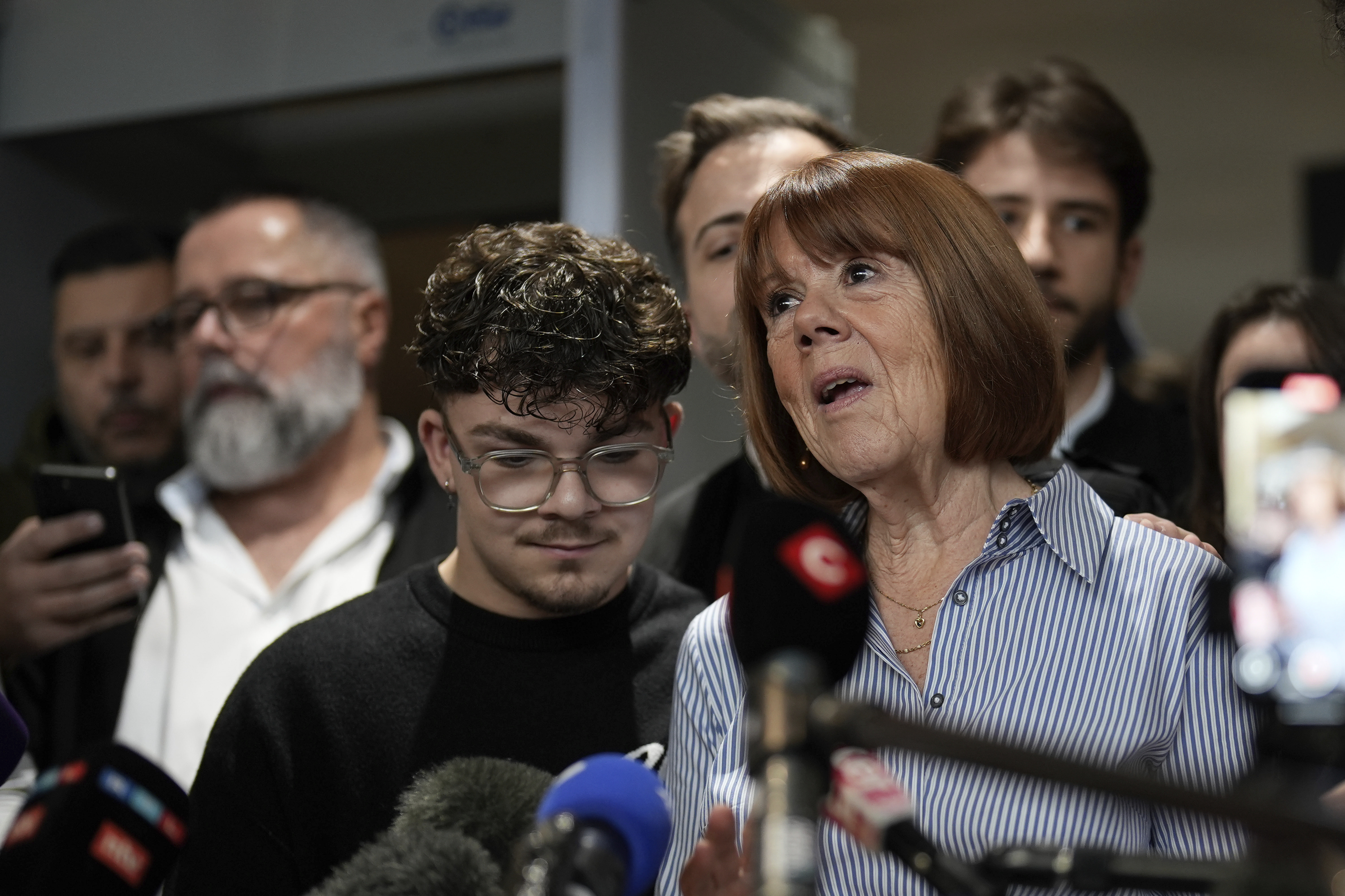 Gisele Pelicot speaks to the press as she leaves the courtroom, in the Avignon courthouse, southern France, Thursday, Dec. 19, 2024. (AP Photo/Lewis Joly)