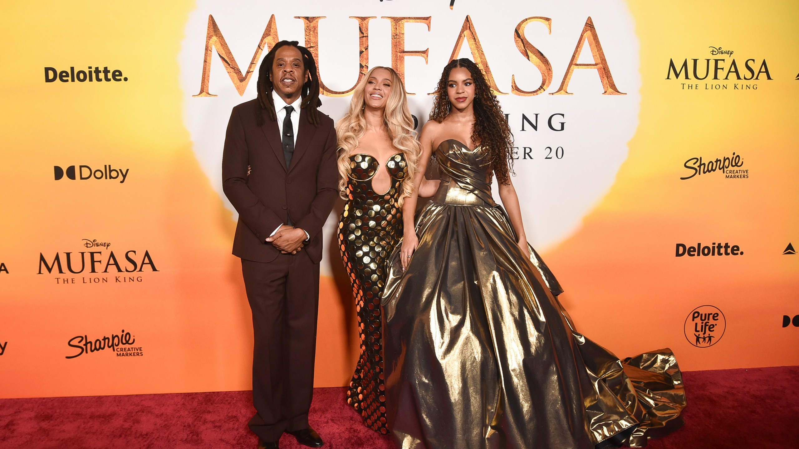 Jay-Z, from left, Beyoncé and Blue Ivy Carter arrive at the premiere of "Mufasa: The Lion King" on Monday, Dec. 9, 2024, at the Dolby Theatre in Los Angeles. (Photo by Richard Shotwell/Invision/AP)