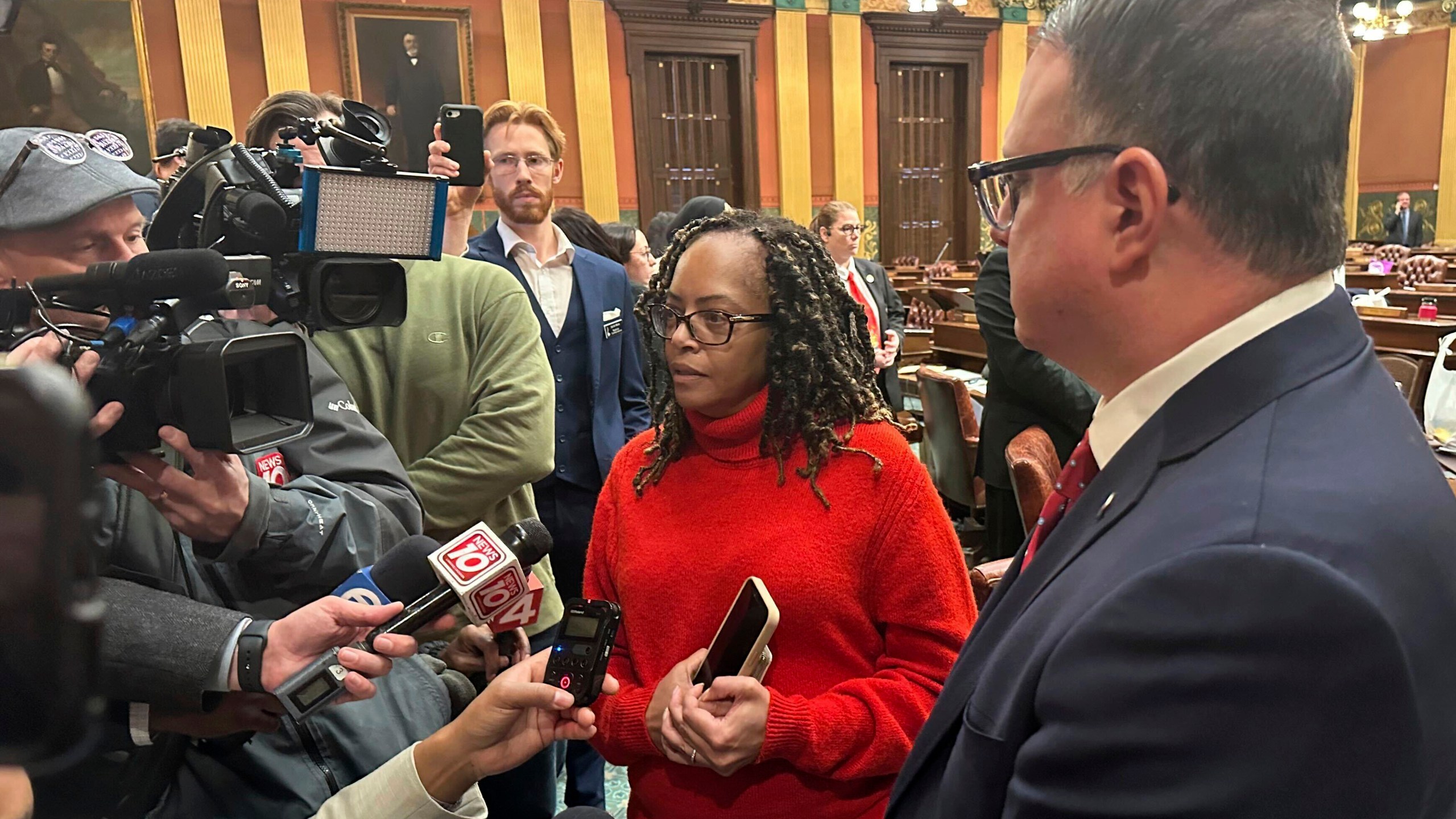 Michigan state Rep. Karen Whitsett, a Detroit Democrat, speaks to reporters in the Michigan House of Representatives in Lansing, Mich., Thursday, Dec. 19, 2024, alongside Republican minority leader Matt Hall. (AP Photo/Isabella Volmert)