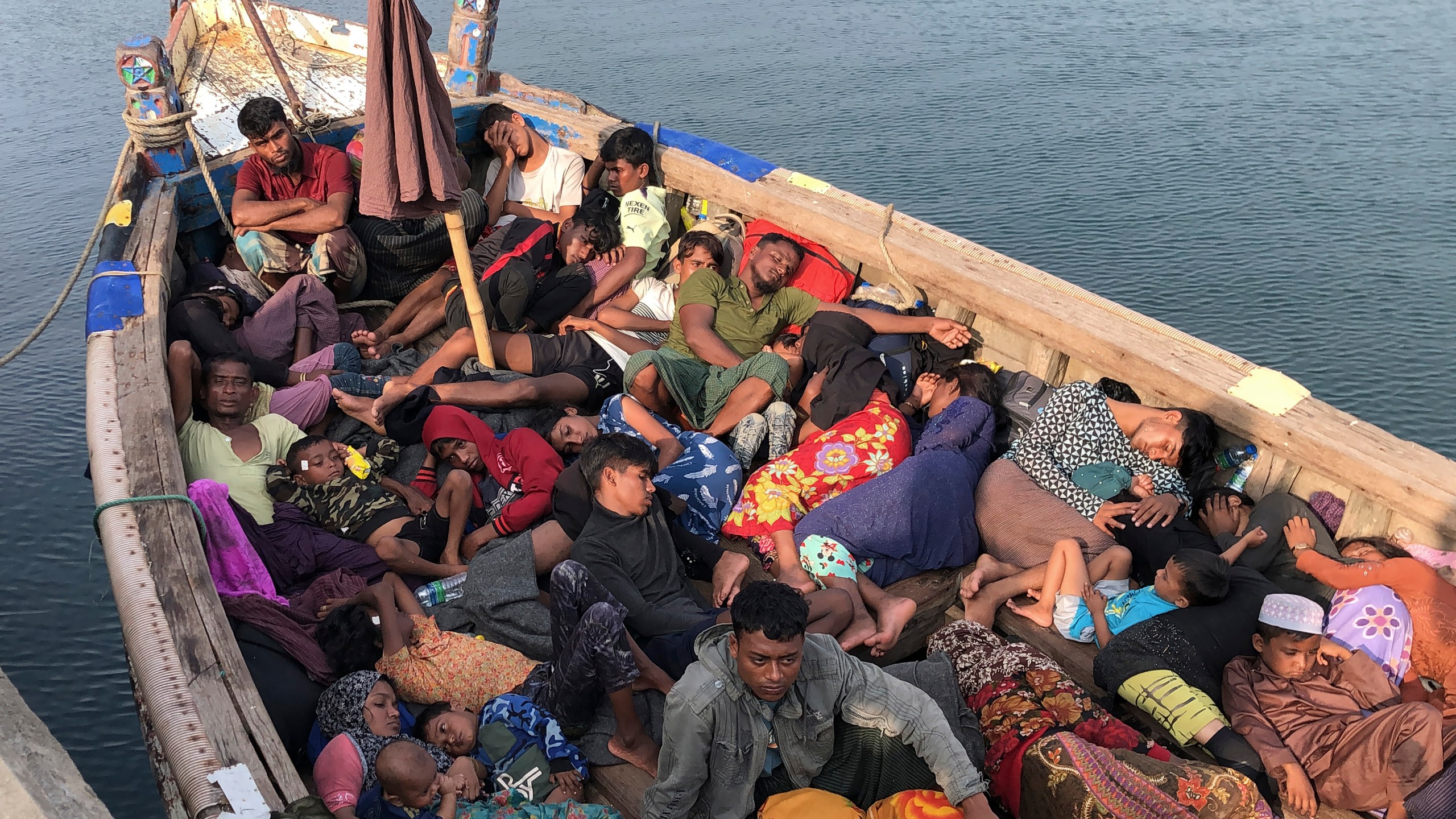 A group of people believed to be Rohingya refugees, rest in a boat at a port in Trincomalee, Sri Lanka, Friday, Dec. 20, 2024. (AP Photo/Mangalanath Liyanaarahhi)