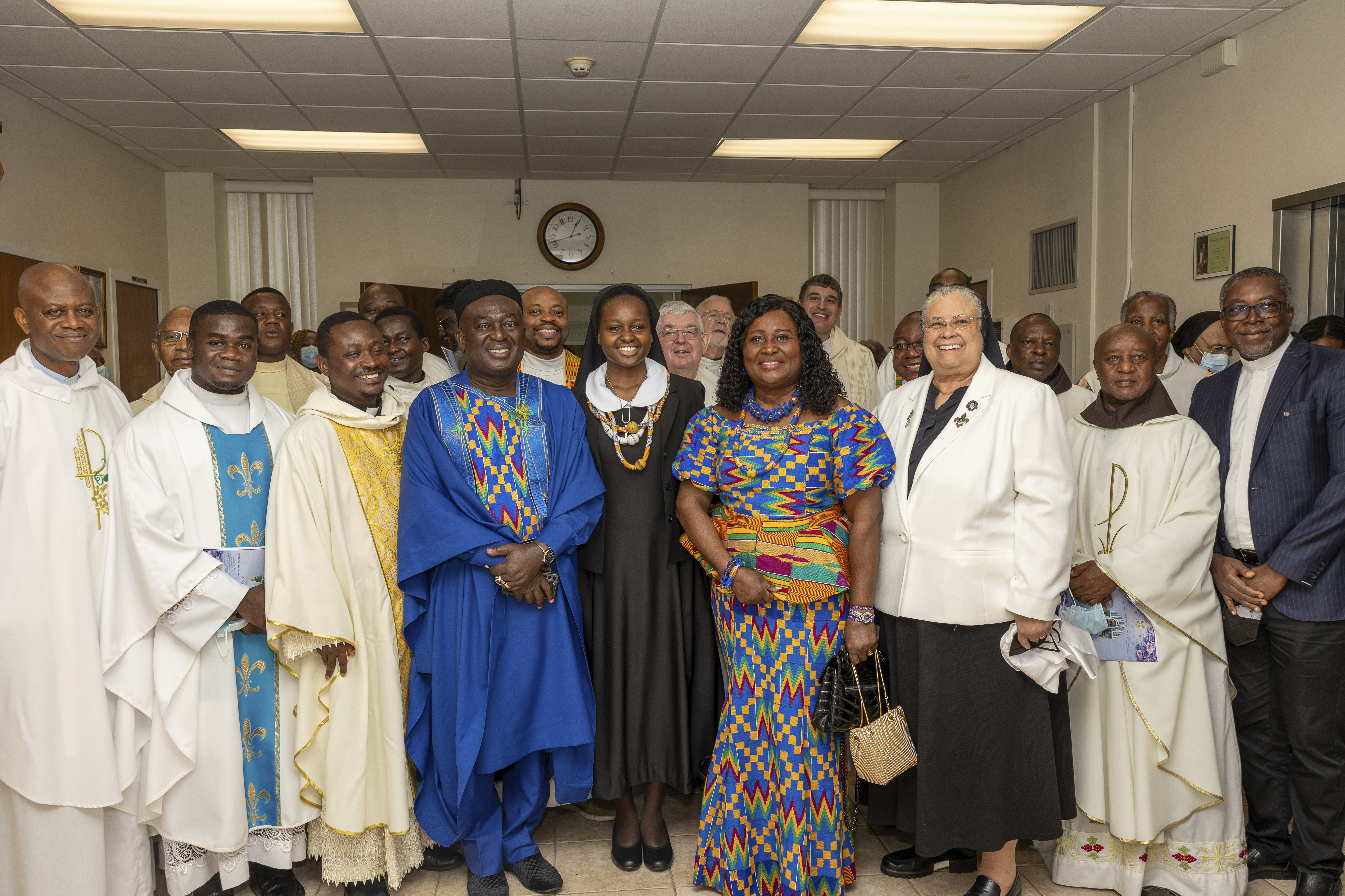 In this photo provided by Edem M. Adzokpa, Sister Seyram Mary Adzokpa, center, is surrounded by her fellow sisters, friends and family after making her first profession at the Sisters of the Holy Family in New Orleans on Thursday, Aug. 15, 2024. (Edem M. Adzokpa via AP)