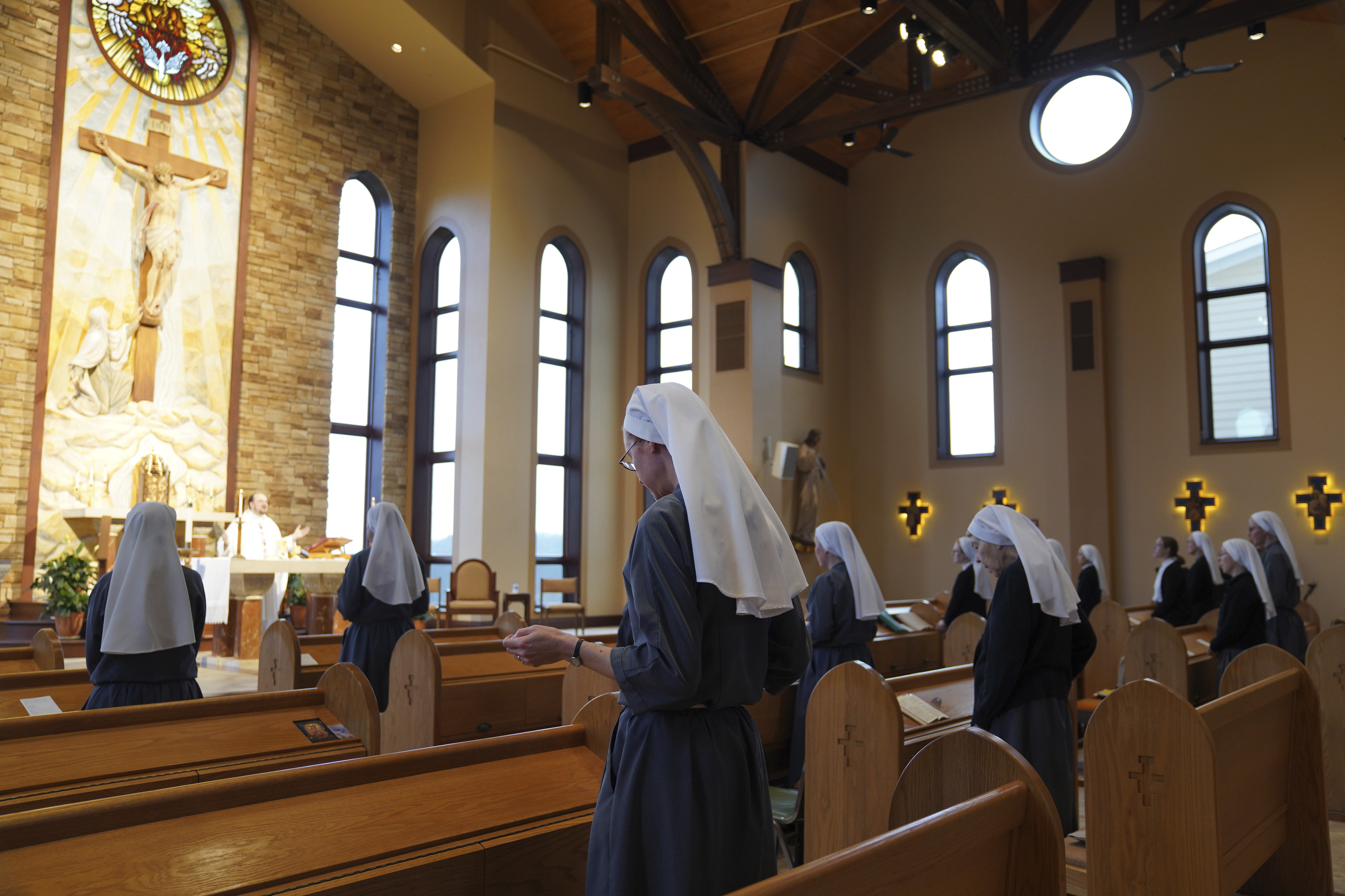 The Franciscan Sisters, T.O.R. of Penance of the Sorrowful Mother stand during Mass in Toronto, Ohio, Thursday, Nov. 7, 2024. (AP Photo/Jessie Wardarski)