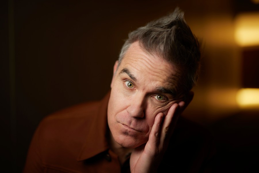 Robbie Williams poses for a portrait to promote the film "Better Man" on Wednesday, Nov. 13, 2024, in New York. (Photo by Matt Licari/Invision/AP)