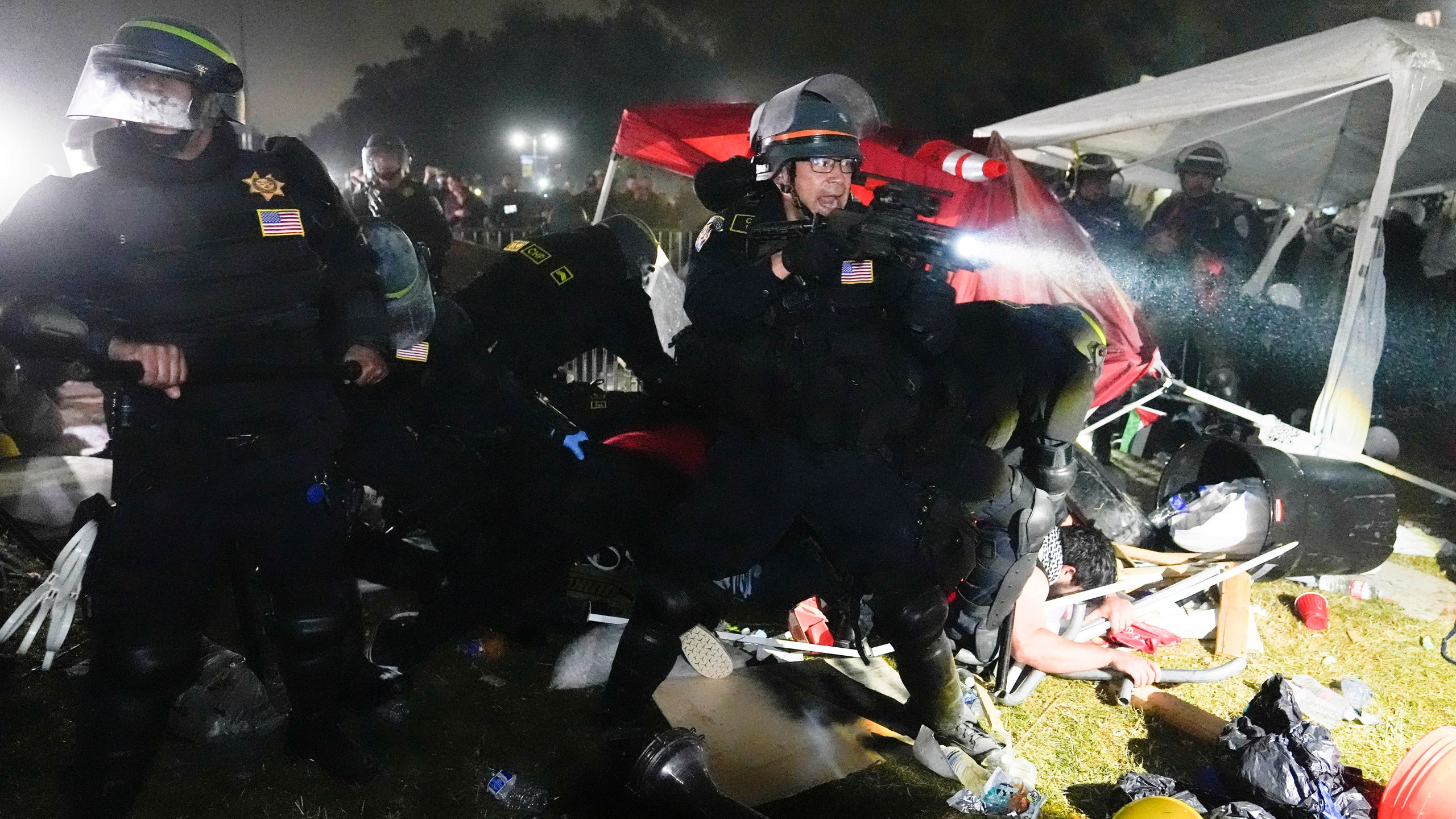 FILE - Police advance on pro-Palestinian demonstrators after defying orders to leave at an encampment on the UCLA campus, in Los Angeles, May 2, 2024. (AP Photo/Jae C. Hong, File)