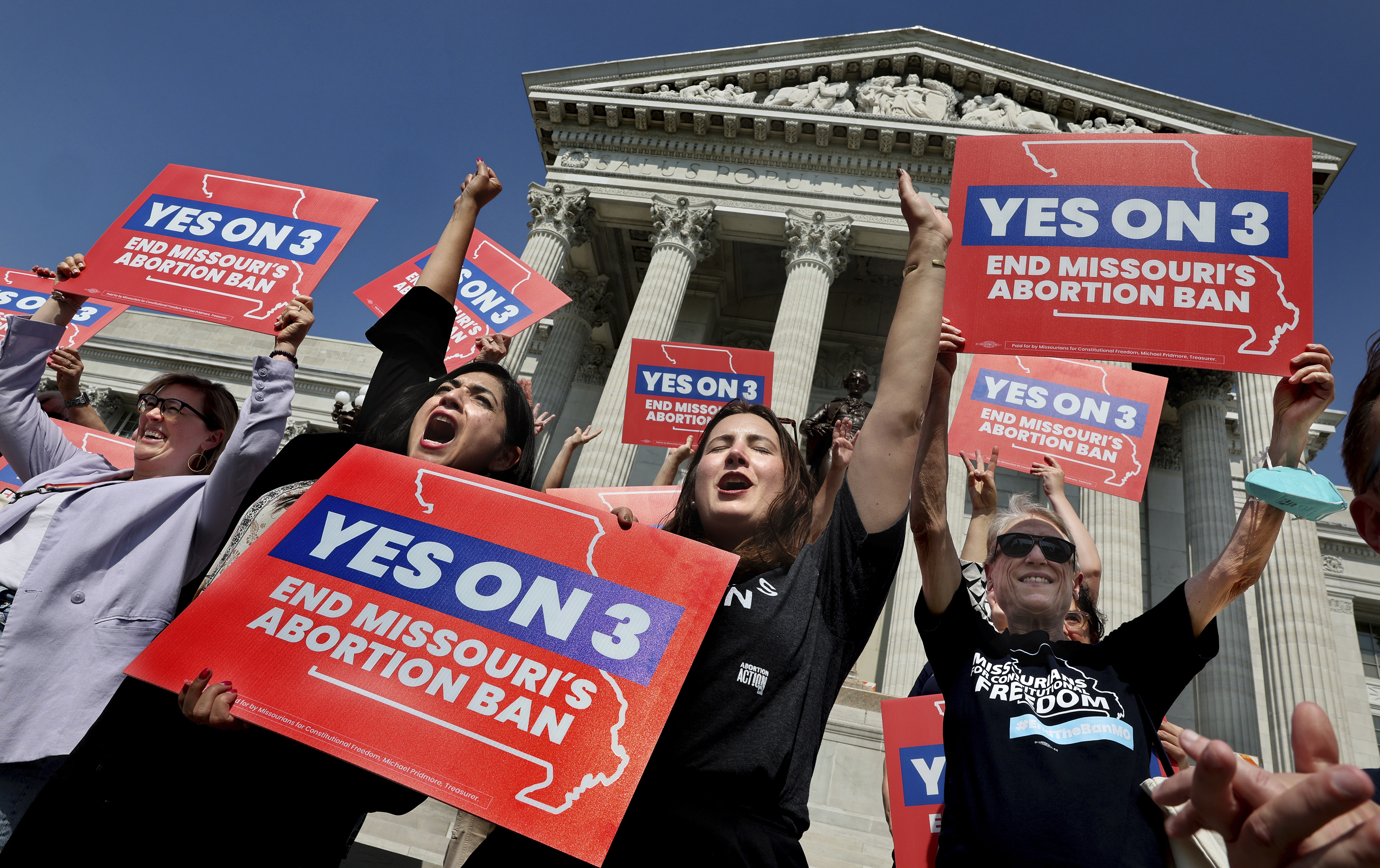 FILE - Amendment 3 supporters Luz Maria Henriquez, second from left, executive director of the ACLU Missouri, celebrates with Mallory Schwarz, center, of Abortion Action Missouri, after the Missouri Supreme Court in Jefferson City, Mo., ruled that the amendment to protect abortion rights would stay on the November ballot. Abortion-rights advocates will ask a judge Wednesday, Dec. 4, 2024 to overturn Missouri’s near-total ban on the procedure, less than a month after voters backed an abortion-rights constitutional amendment. (Robert Cohen/St. Louis Post-Dispatch via AP, File)