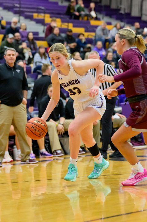 Grand Island High School's Emmy Ward dribbles during a girls high school basketball game against Norfolk High School, Jan. 26, 2024 in Grand Island, Neb. (Jimmy Rash via AP)