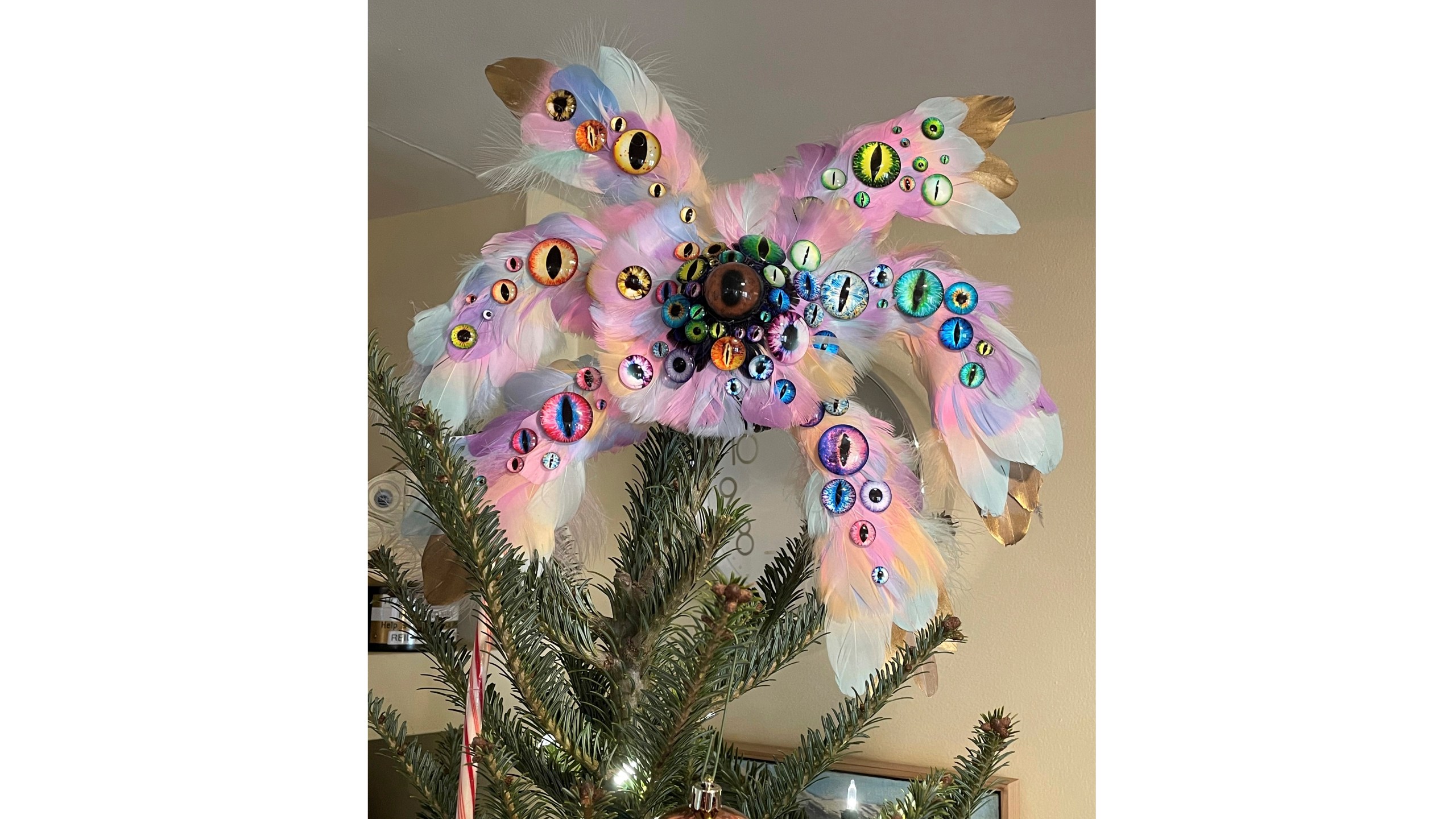 This Dec. 12, 2021, photo shows the biblically accurate angel Christmas tree topper created by the Rev. Kira Austin-Young and her puppet-maker husband, Michael Schupbach, atop the tree in their former home in Nashville, Tenn. (Kira Austin-Young via AP)