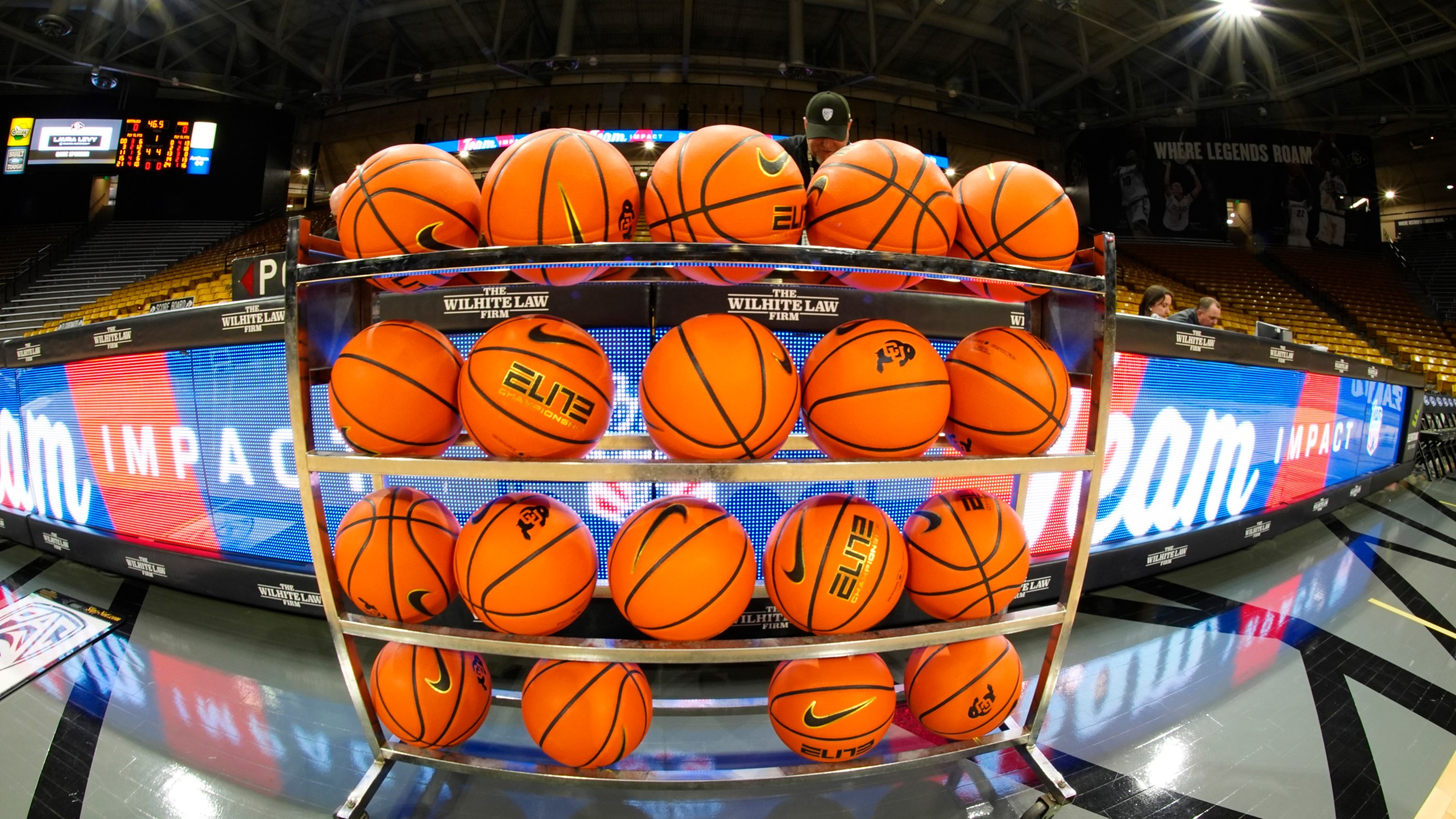 FILE - In this image taken with a fisheye lens , basketballs sit in a rack for players to warm up before an NCAA college basketball game between Colorado and Washington State, Saturday, March 2, 2024, in Boulder, Colo. (AP Photo/David Zalubowski, File)