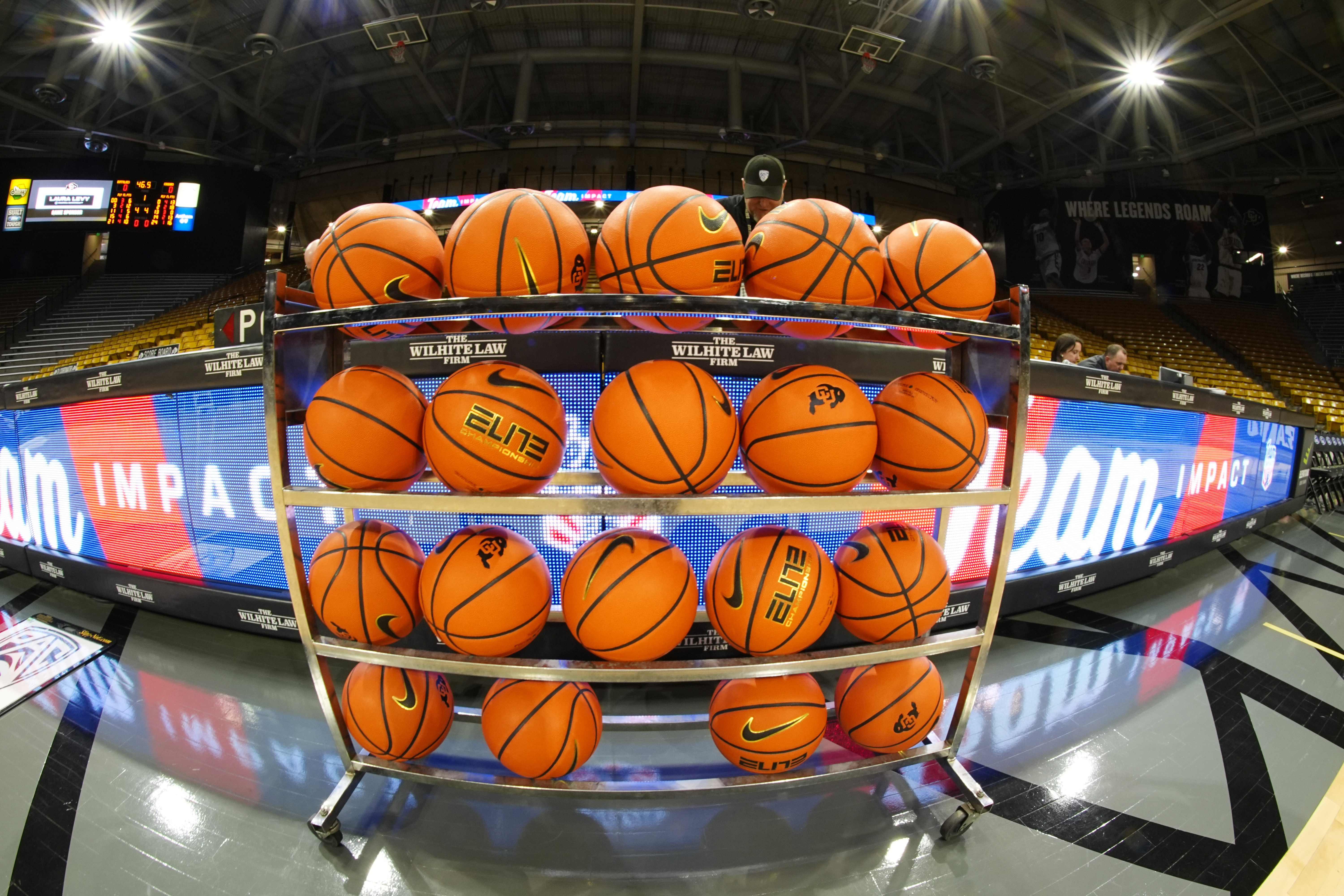 FILE - In this image taken with a fisheye lens , basketballs sit in a rack for players to warm up before an NCAA college basketball game between Colorado and Washington State, Saturday, March 2, 2024, in Boulder, Colo. (AP Photo/David Zalubowski, File)