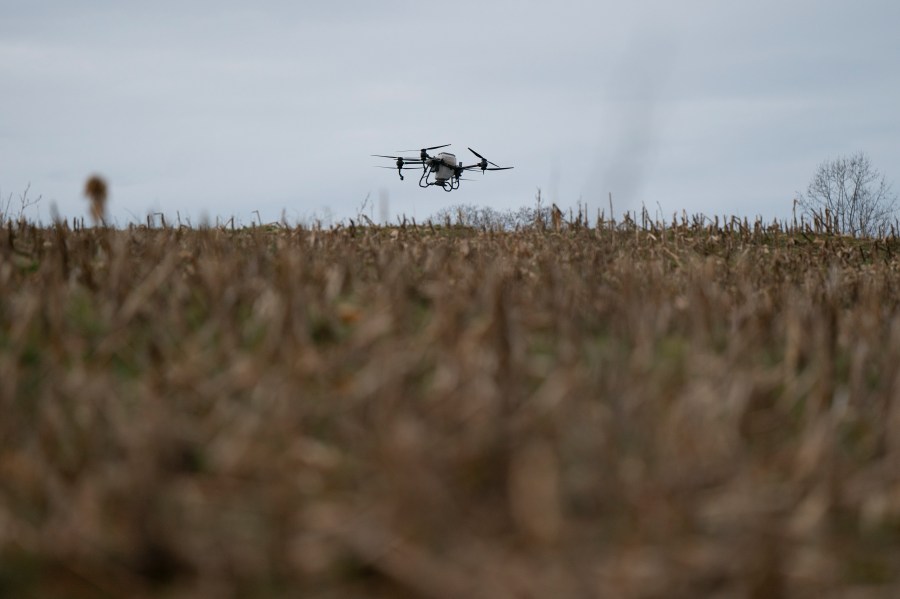 Russell Hedrick's DJI drone puts crop cover on his farm, Tuesday, Dec. 17, 2024, in Hickory, N.C. (AP Photo/Allison Joyce)