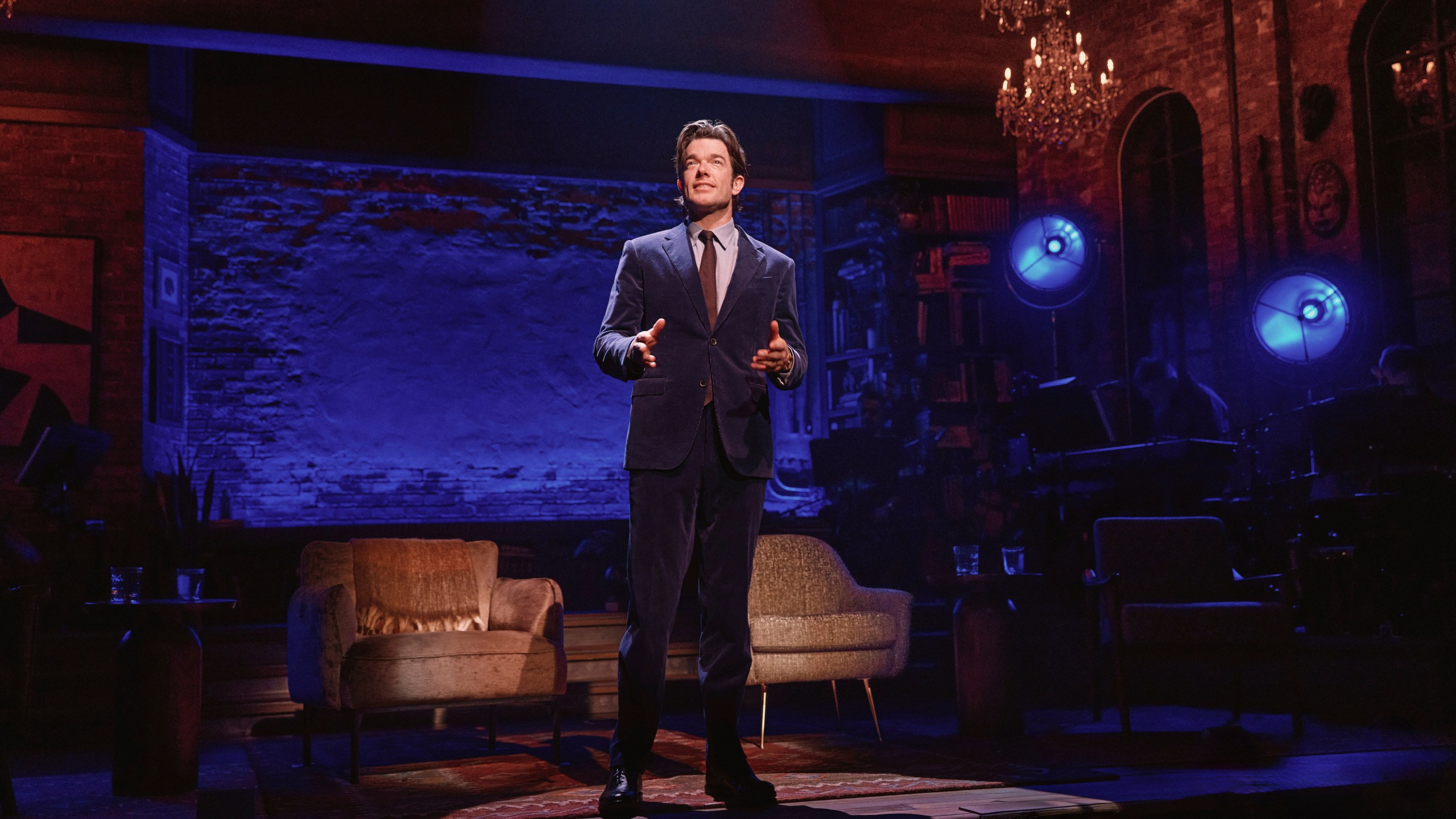 This photo provided by O+M/DKC in December 2024 shows John Mulaney performing in “All In: Comedy About Love” in New York. (Emilio Madrid/O+M/DKC via AP)