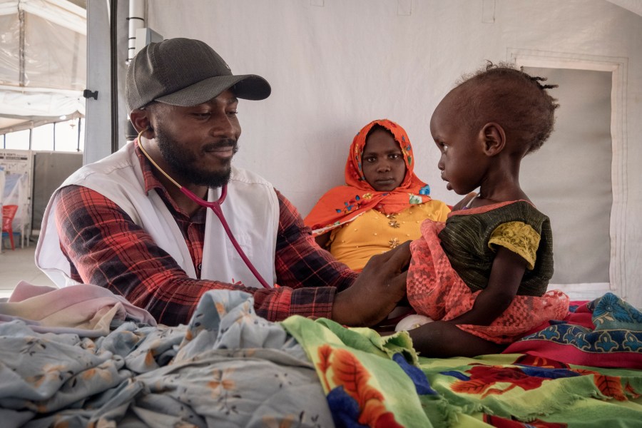 FILE - A doctor treats a Sudanese child suffering from malnutrition are treated at an MSF clinic in Metche Camp, Chad, near the Sudanese border, on April 6, 2024. (AP Photo/Patricia Simon, File)