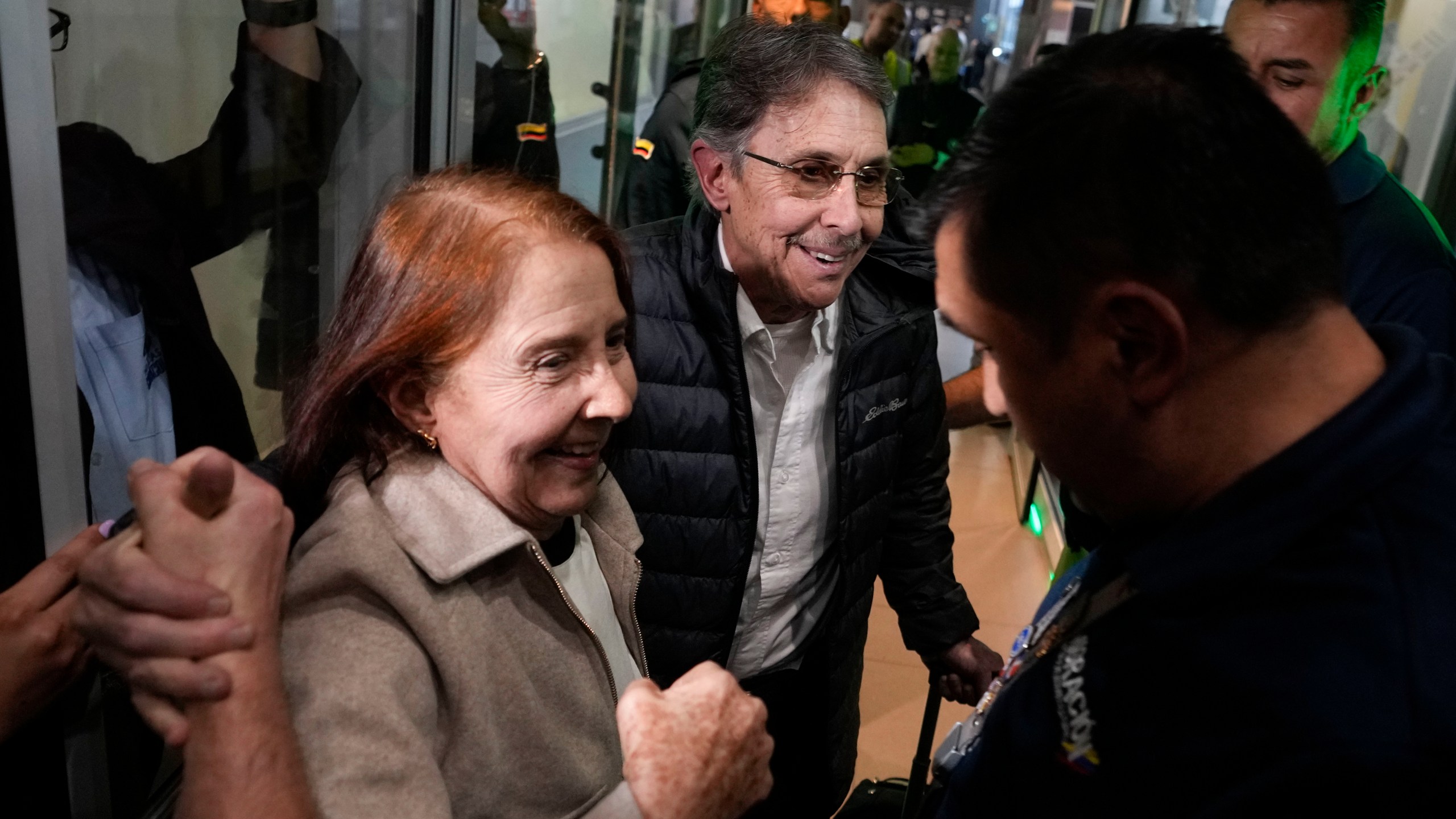 Fabio Ochoa, center, a former member of Cartel of Medellin, is welcomed by relatives upon arriving at El Dorado airport after being deported from the United States, in Bogota, Colombia, Monday, Dec. 23, 2024. (AP Photo/Fernando Vergara)