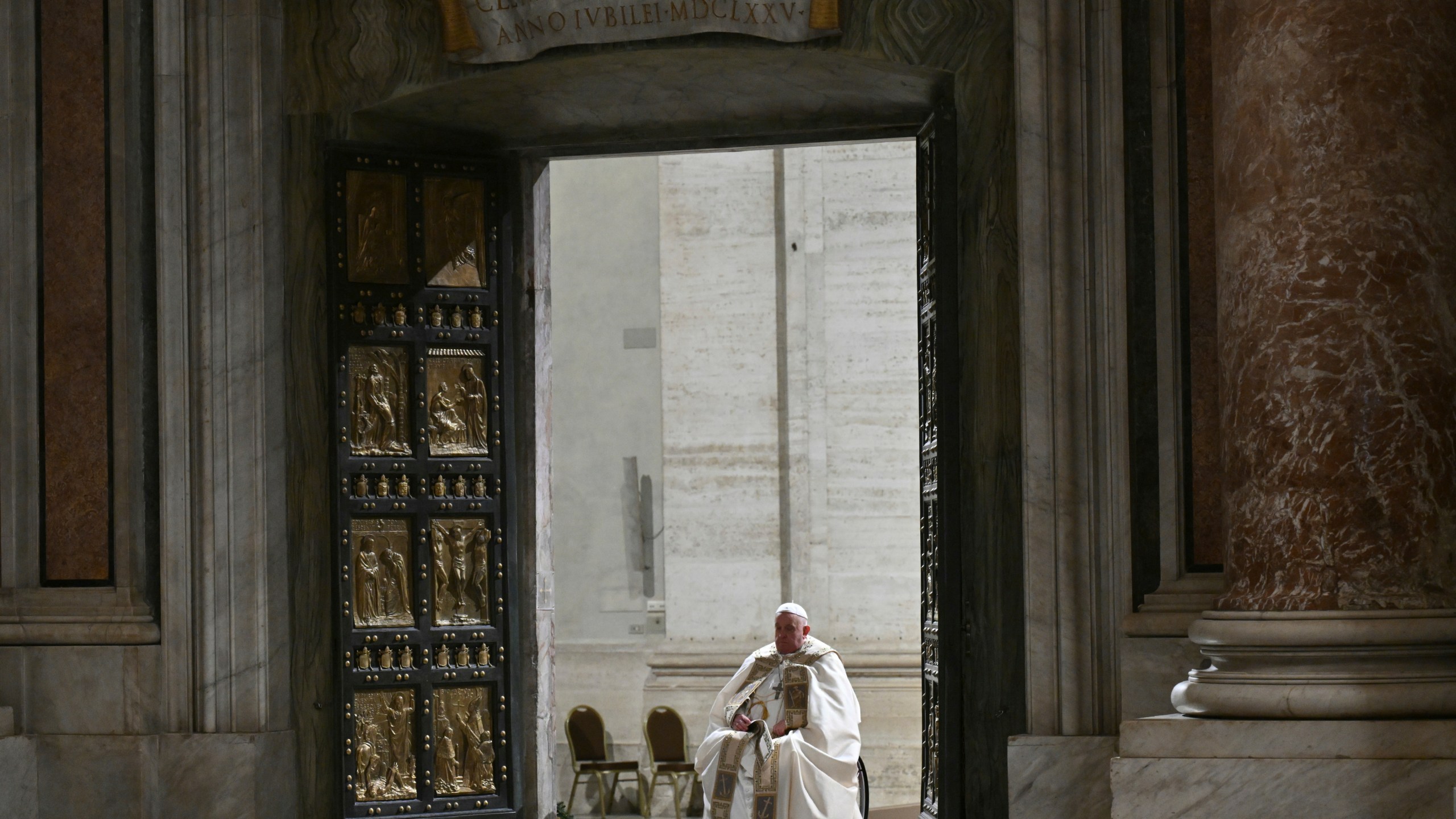 Pope Francis opens the Holy Door of St Peter's Basilica to mark the start of the Catholic Jubilee Year, at the Vatican, Dec. 24, 2024. (Alberto Pizzoli/Pool Photo via AP)