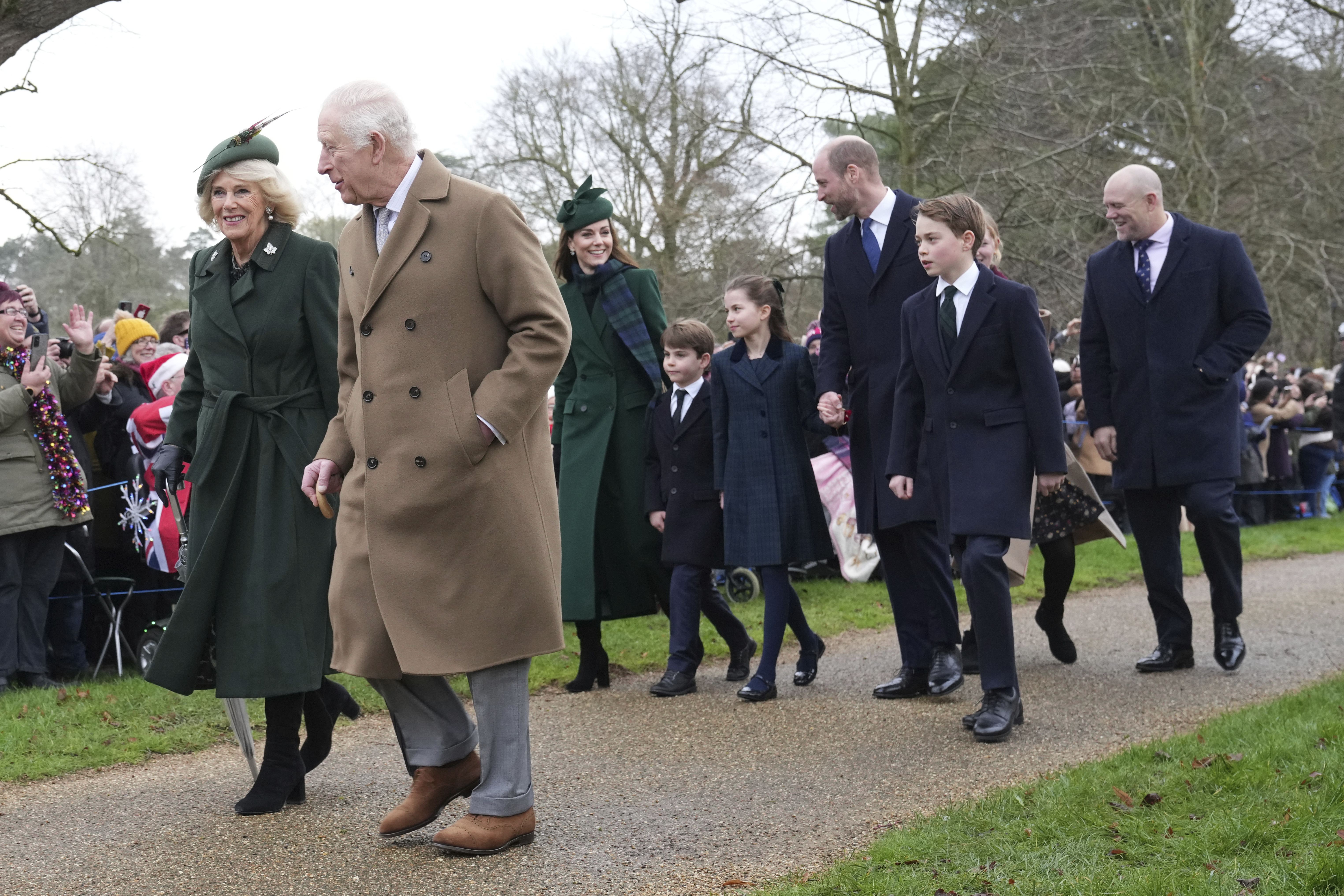 Britain's King Charles IIIt, second left, with Queen Camilla, Kate Princess of Wales, Prince Louis, Princess Charlotte, Prince William, Prince George and at right Mike Tindall arrive for the Christmas day service at St Mary Magdalene Church in Sandringham in Norfolk, England, Wednesday, Dec. 25, 2024. (AP Photo/Jon Super)