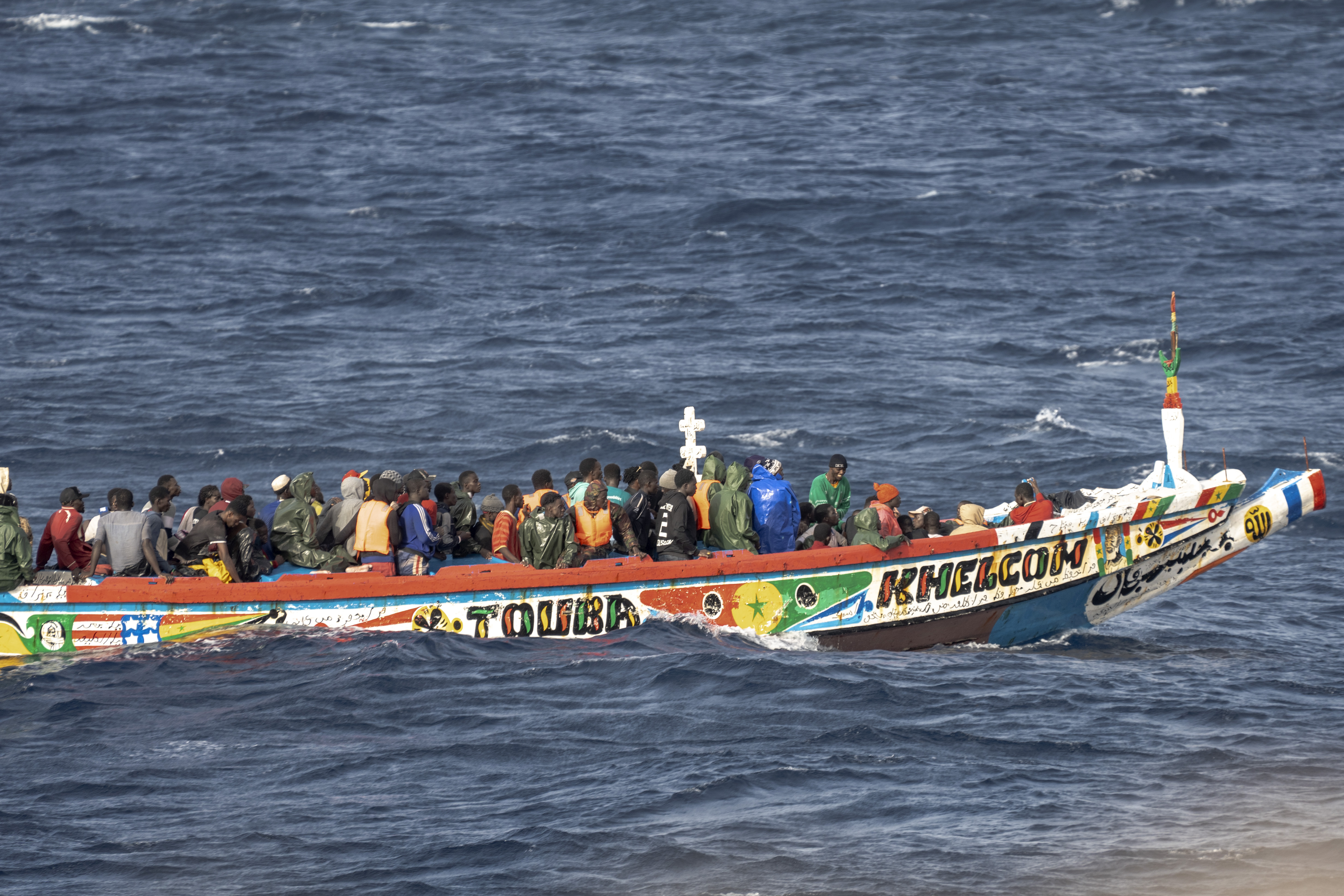 FILE - Migrants crowd a wooden boat as they sail to the port in La Restinga on the Canary island of El Hierro, Spain, Monday, Aug. 19, 2024. (AP Photo/Maria Ximena, File)