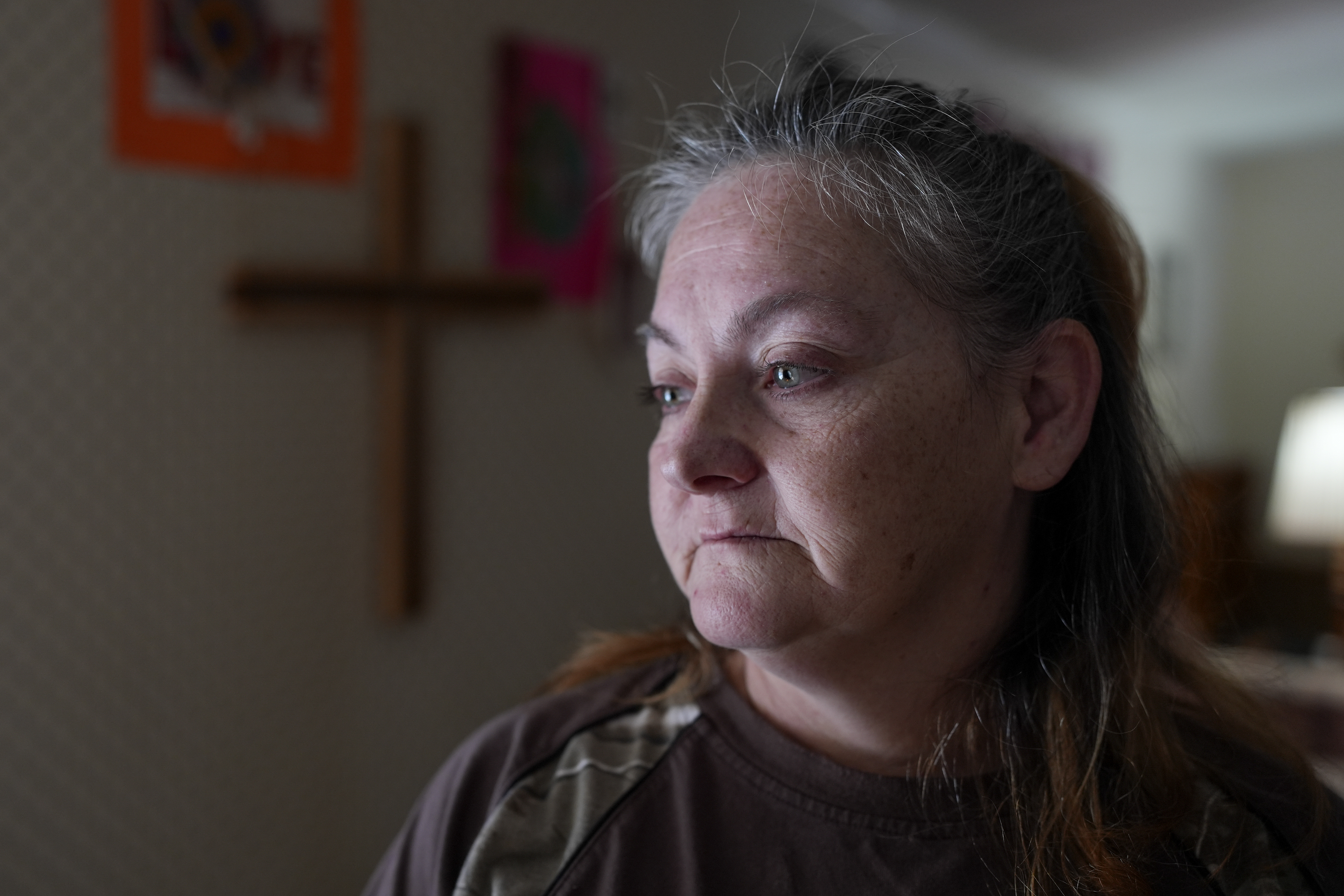 Zinnia Adkins poses for a portrait on Nov. 22, 2024, in Unicoi, Tenn. Adkins escaped flood waters caused by Hurricane Helene in September at the plastics factory where she worked. (AP Photo/George Walker IV)