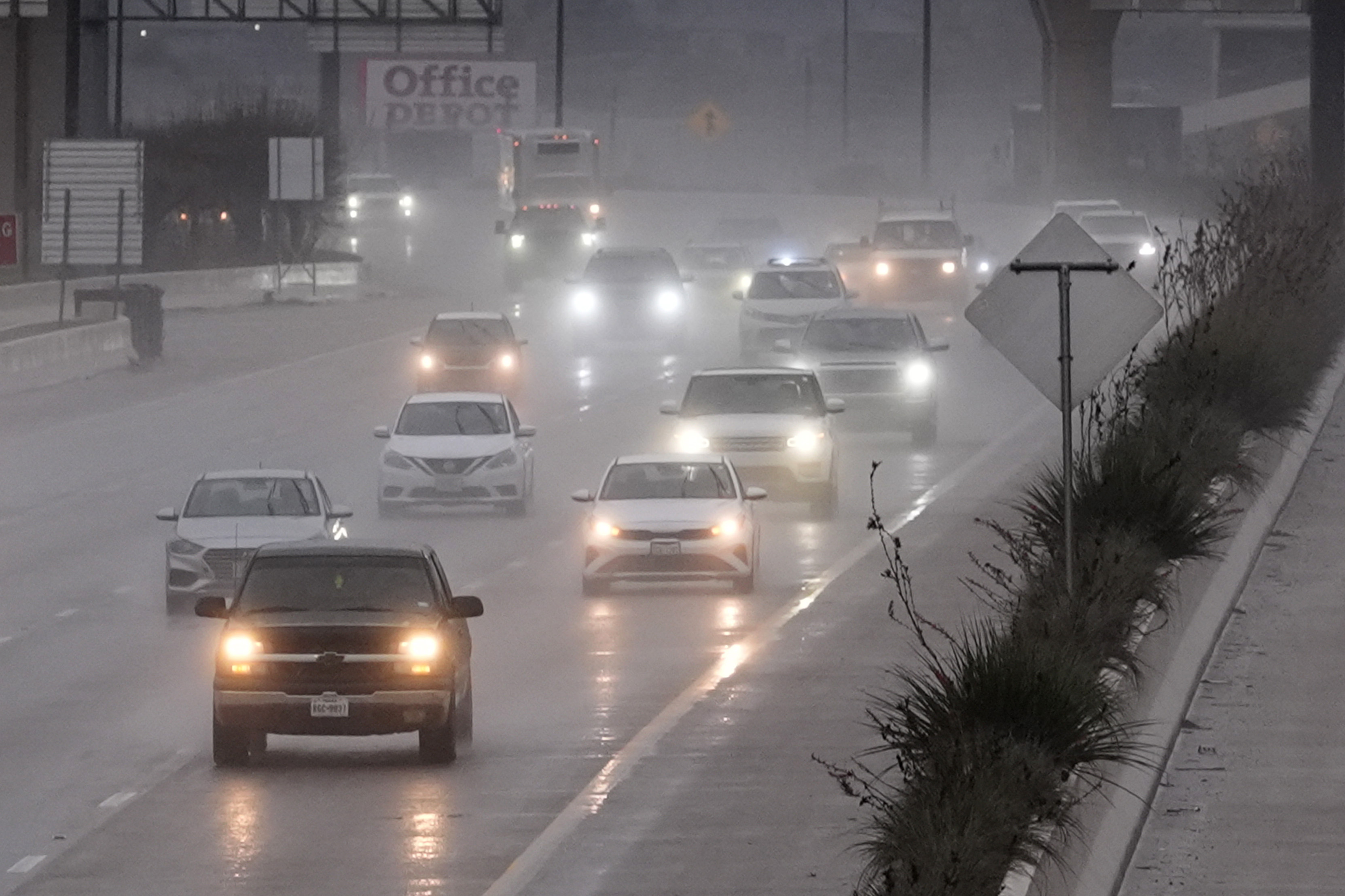 Vehicles make their way on a rain soaked highway in Dallas, Thursday, Dec. 26, 2024. (AP Photo/LM Otero)