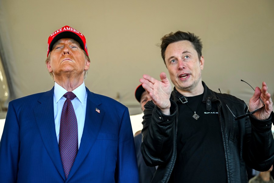 FILE - President-elect Donald Trump listens to Elon Musk as he arrives to watch SpaceX's mega rocket Starship lift off for a test flight from Starbase in Boca Chica, Texas, Nov. 19, 2024. (Brandon Bell/Pool via AP, File)