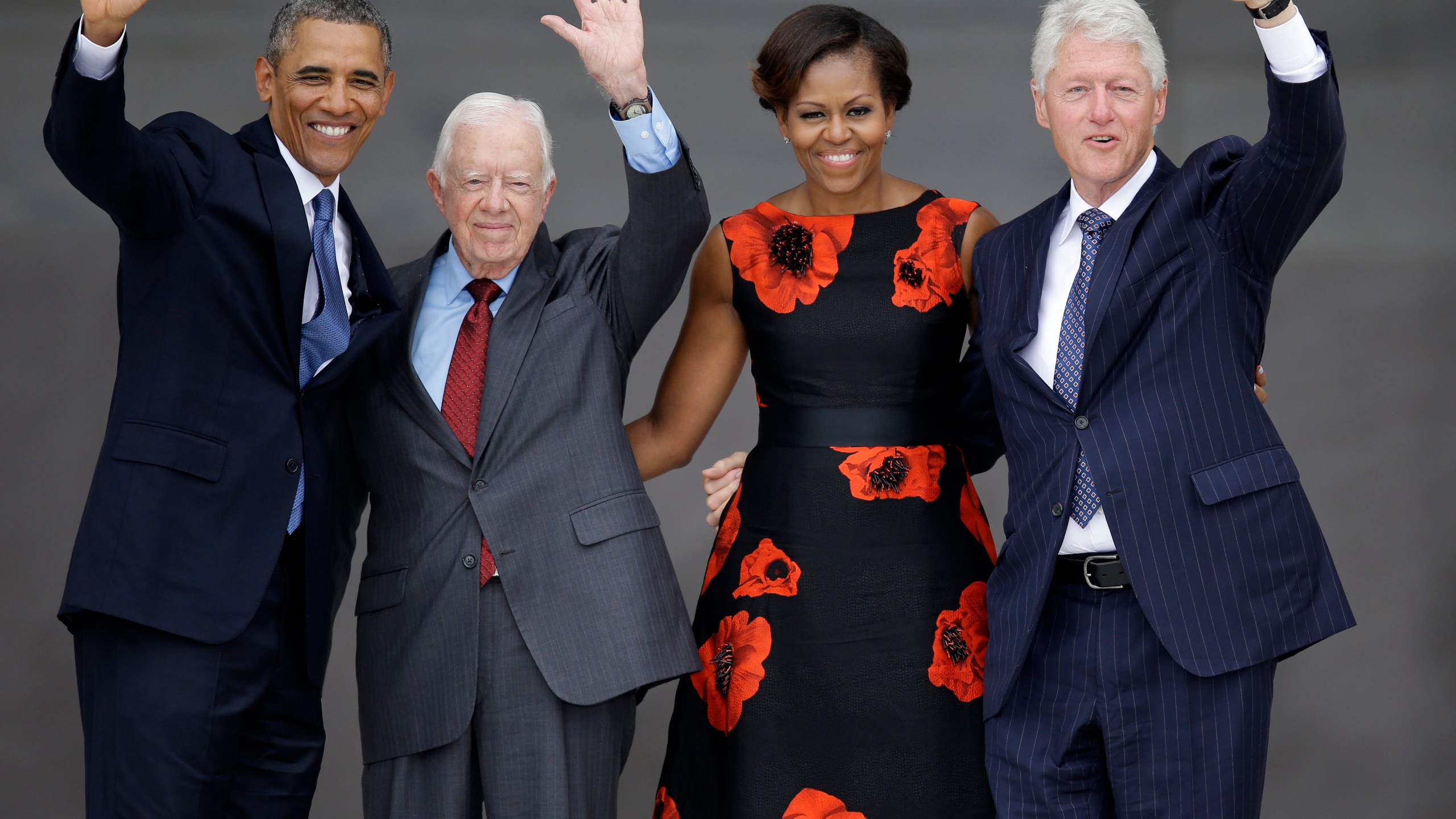 FILE - From left, President Barack Obama, former President Jimmy Carter, first lady Michelle Obama and former President Bill Clinton wave to the crowd from the steps of the Lincoln Memorial in Washington at the conclusion of a ceremony to commemorate the 50th anniversary of the 1963 March on Washington for Jobs and Freedom, Aug. 28, 2013. (AP Photo/Carolyn Kaster, File)