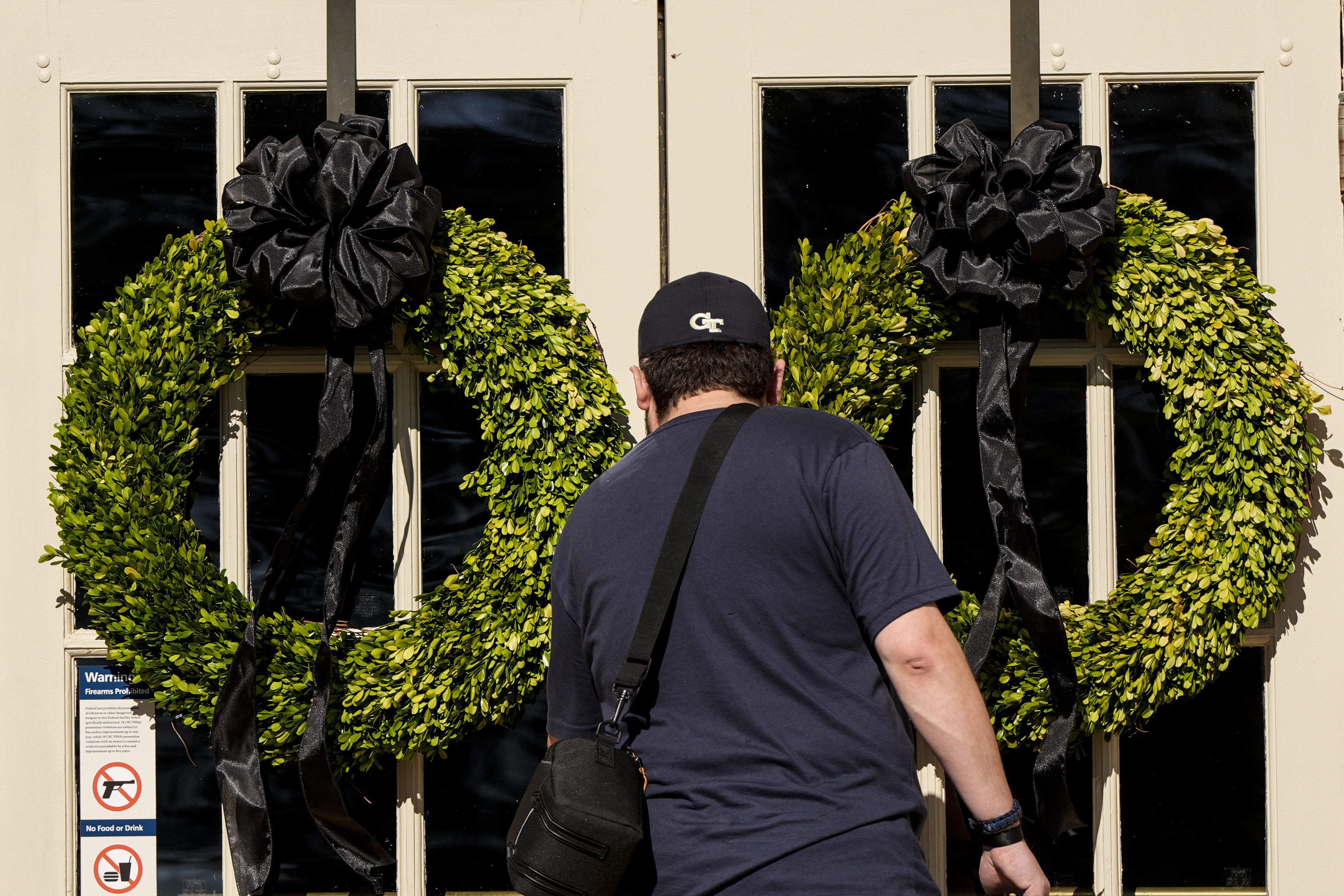 A man enters the Jimmy Carter National Historical Park, Monday, Dec. 30, 2024, in Plains, Ga. Former President Carter died Sunday at the age of 100. (AP Photo/Mike Stewart)