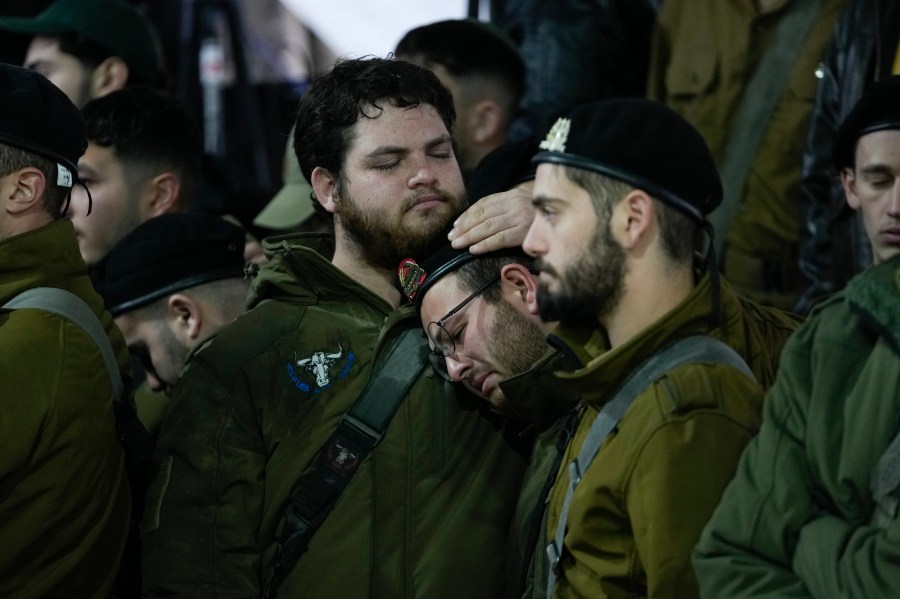 People attend the funeral of 1st Sgt. Yuval Shoham, who was killed in a combat in the Gaza Strip, at Mount Herzl military cemetery in Jerusalem, Monday, Dec. 30, 2024. (AP Photo/Matias Delacroix)