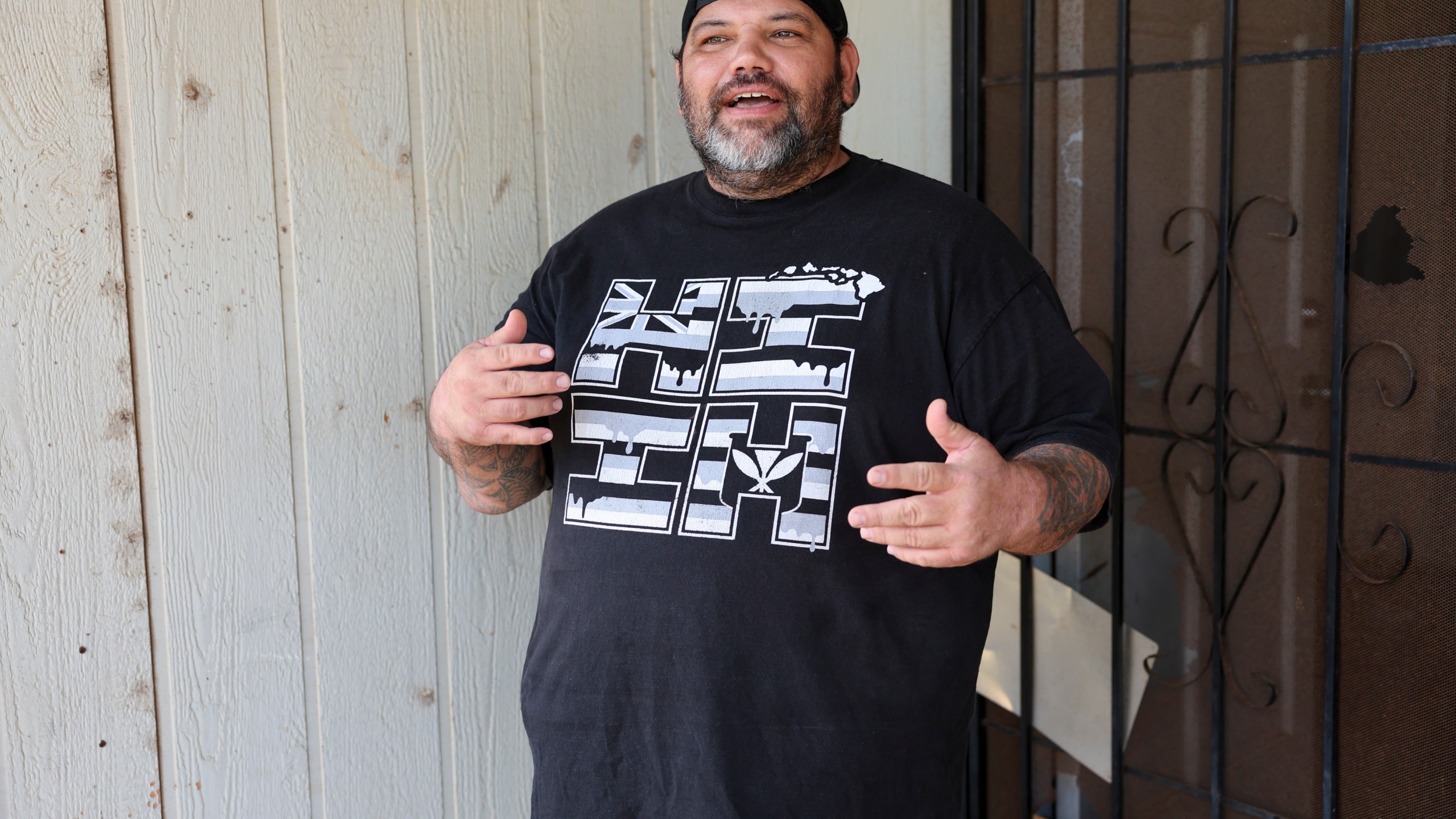 Joshua Kamalo, 43, speaks at his home about his election ordeal after his mail-in ballot was rejected by Maui County stating they couldn't verify his signature, Wednesday, Dec. 18, 2024, in Kahului, Hawaii. (AP Photo/Marco Garcia)