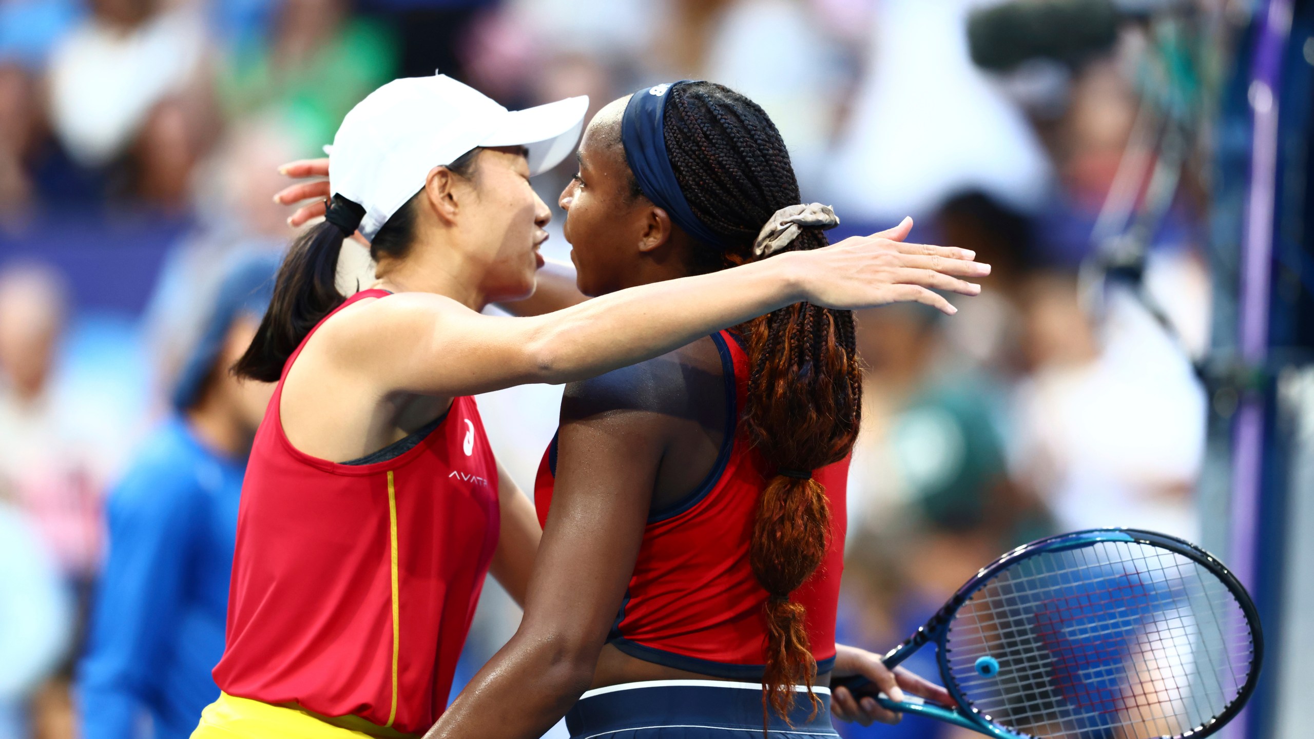 Coco Gauff of the United States, right, after defeating Shuai Zhang of China in their United Cup tennis match in Perth, Australia, Wednesday, Jan. 1, 2025. (AP Photo/Trevor Collens)