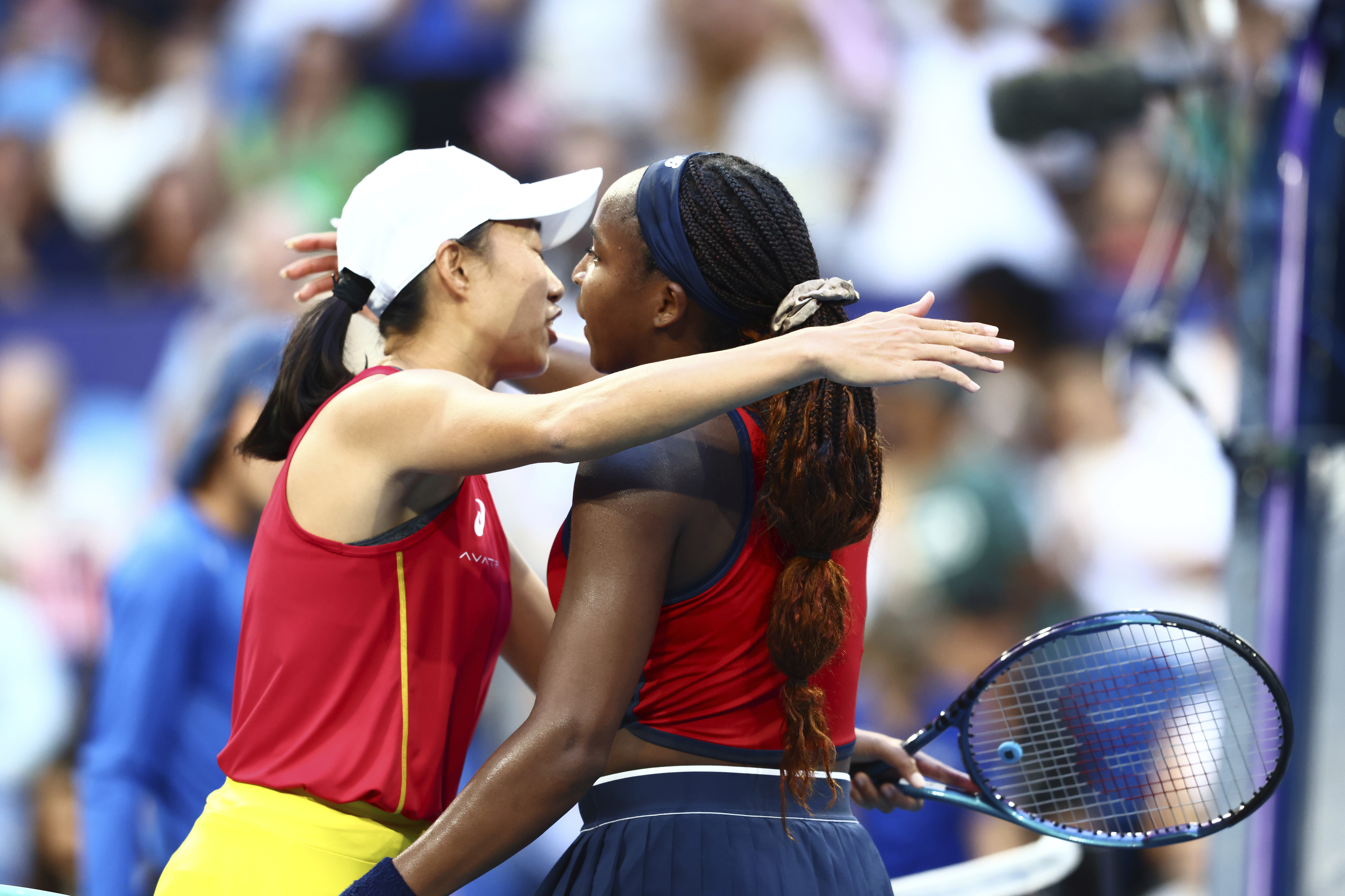 Coco Gauff of the United States, right, after defeating Shuai Zhang of China in their United Cup tennis match in Perth, Australia, Wednesday, Jan. 1, 2025. (AP Photo/Trevor Collens)