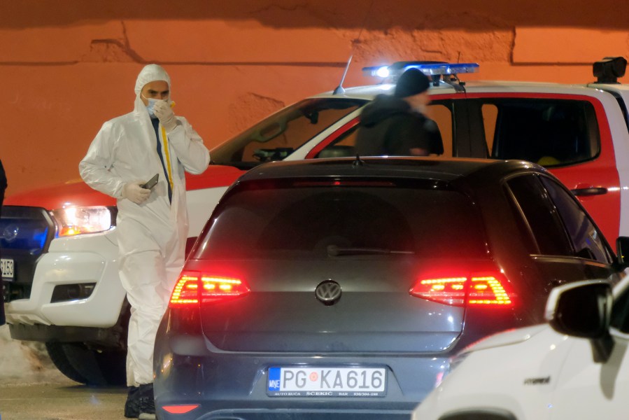 Police investigators work at the site of a shooting in Cetinje, 36 kilometers (22 miles) west of Podogrica, Montenegro, Wednesday, Jan 1, 2025. (AP Photo/Risto Bozovic)