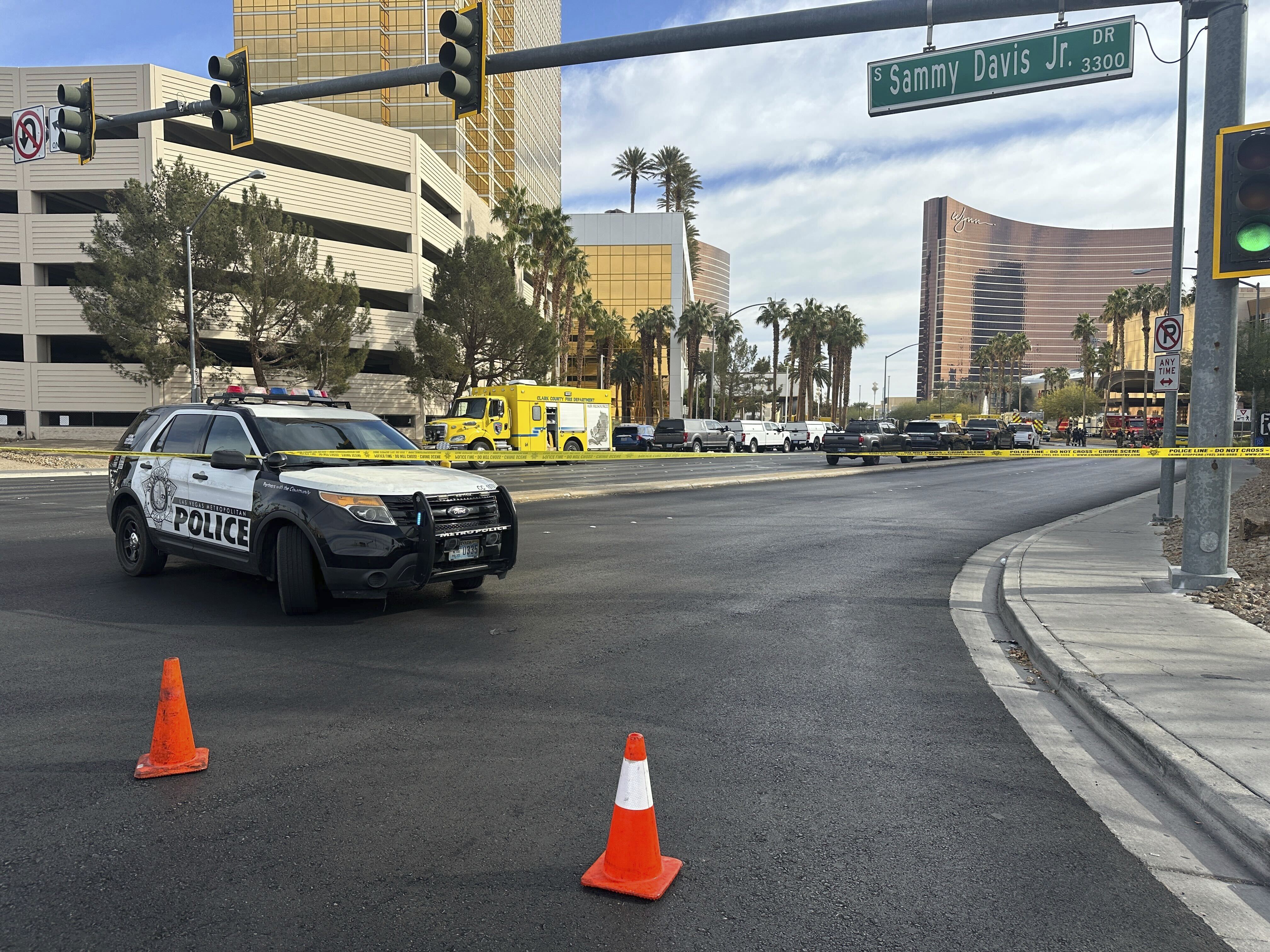 Police block the area after a vehicle caught fire and exploded outside the lobby of President-elect Donald Trump's hotel Wednesday, Jan. 1, 2025. (AP Photo/Ty ONeil)