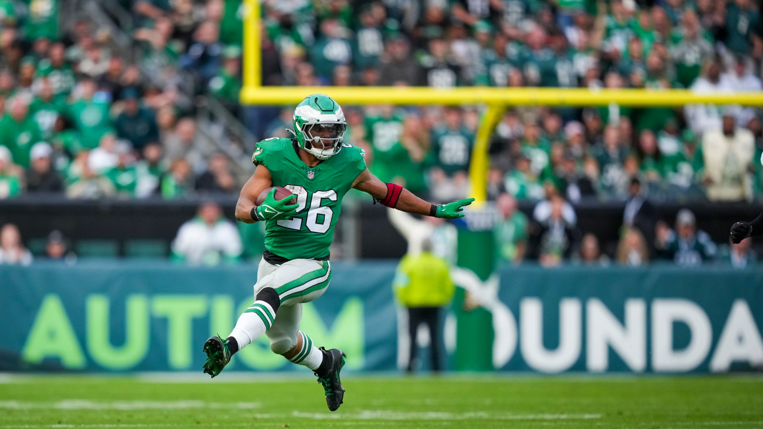 Philadelphia Eagles running back Saquon Barkley (26) runs the ball against the Dallas Cowboys during the second half of an NFL football game, Sunday, Dec. 29, 2024, in Philadelphia. (AP Photo/Matt Slocum)