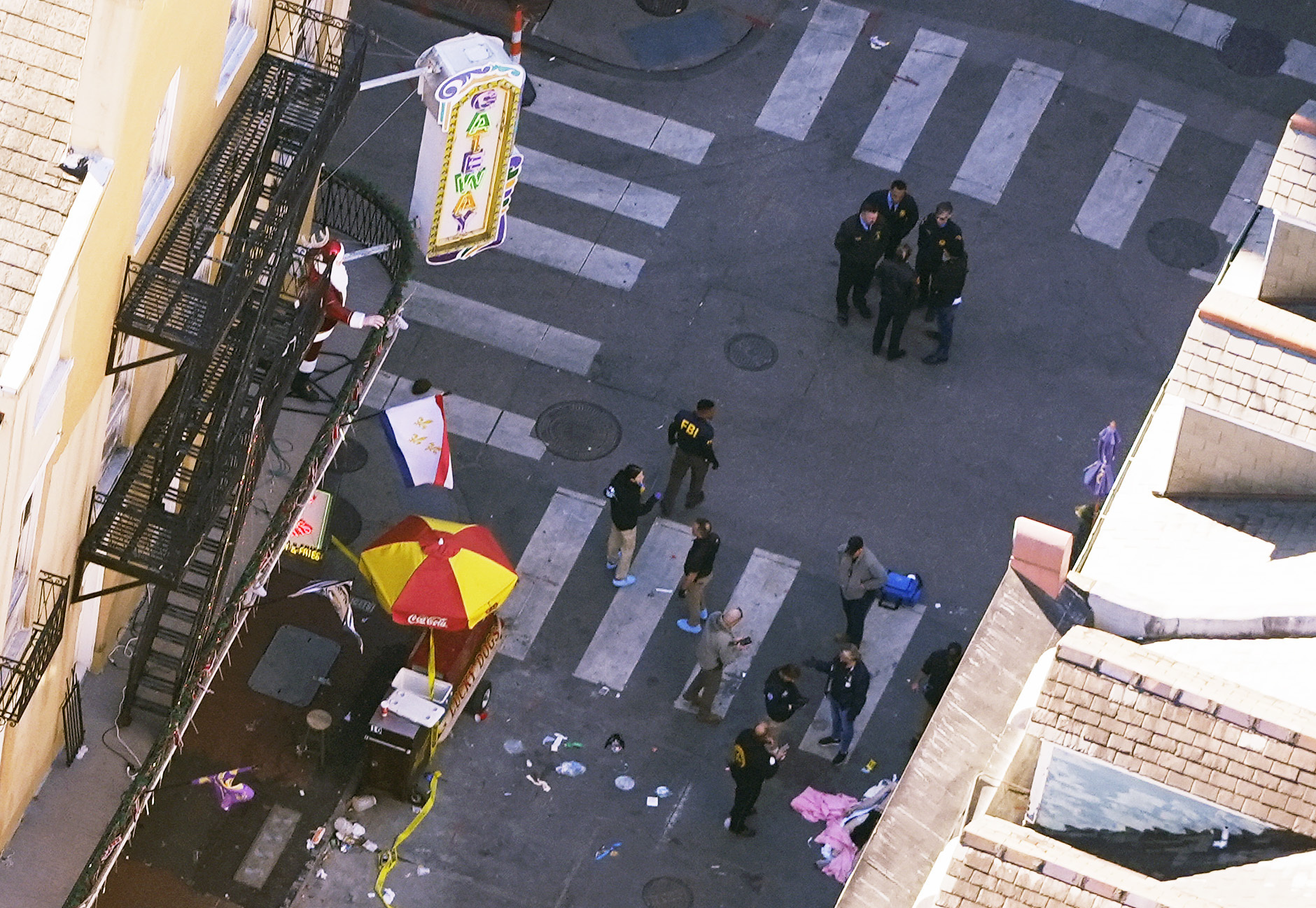 Investigators work the scene after a person drove a vehicle into a crowd killing several, earlier on Canal and Bourbon Street in New Orleans, Wednesday, Jan. 1, 2025. (AP Photo/Gerald Herbert)