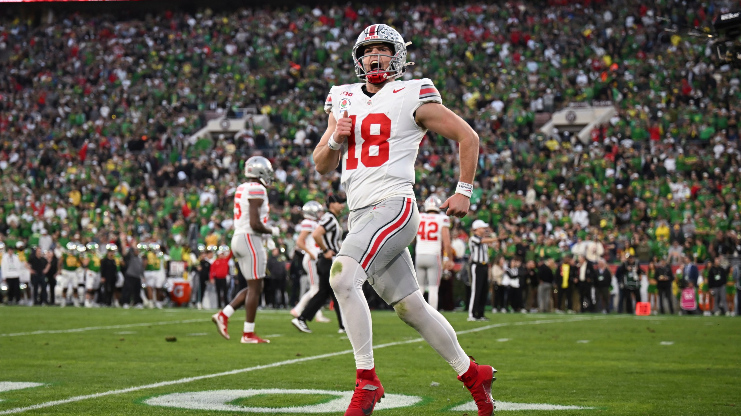 Ohio State quarterback Will Howard (18) reacts after a touchdown against Oregon during the second half in the quarterfinals of the Rose Bowl College Football Playoff, Wednesday, Jan. 1, 2025, in Pasadena, Calif. (AP Photo/Kyusung Gong)