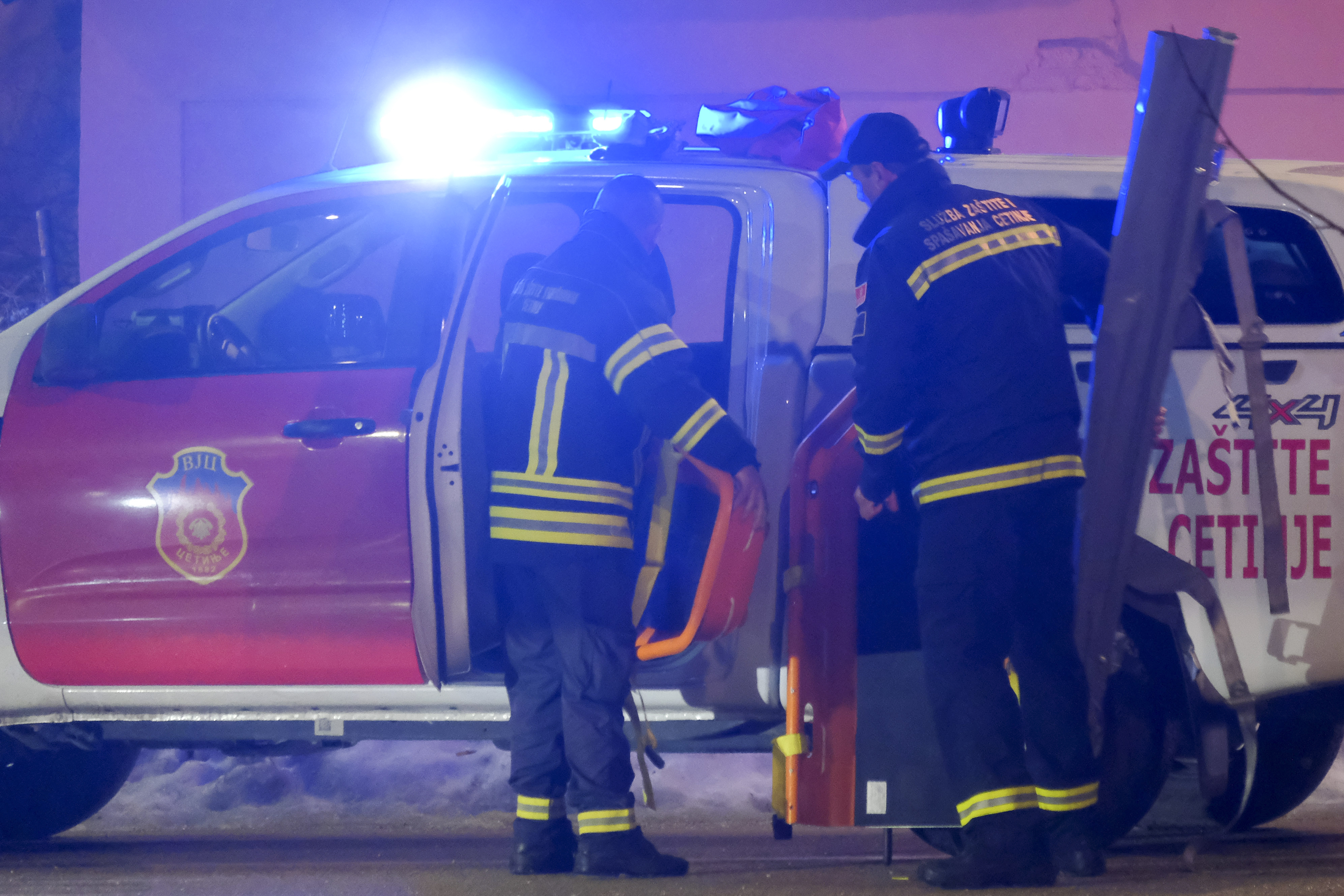 Rescue workers work at the site of a shooting in Cetinje, 36 kilometers (22 miles) west of Podogrica, Montenegro, Wednesday, Jan 1, 2025. (AP Photo/Risto Bozovic)